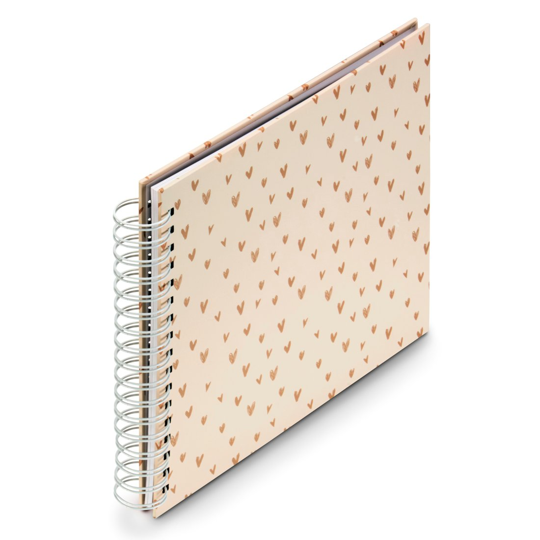 Otwarty notatnik spiralny z okładką zadrukowaną małymi serduszkami.