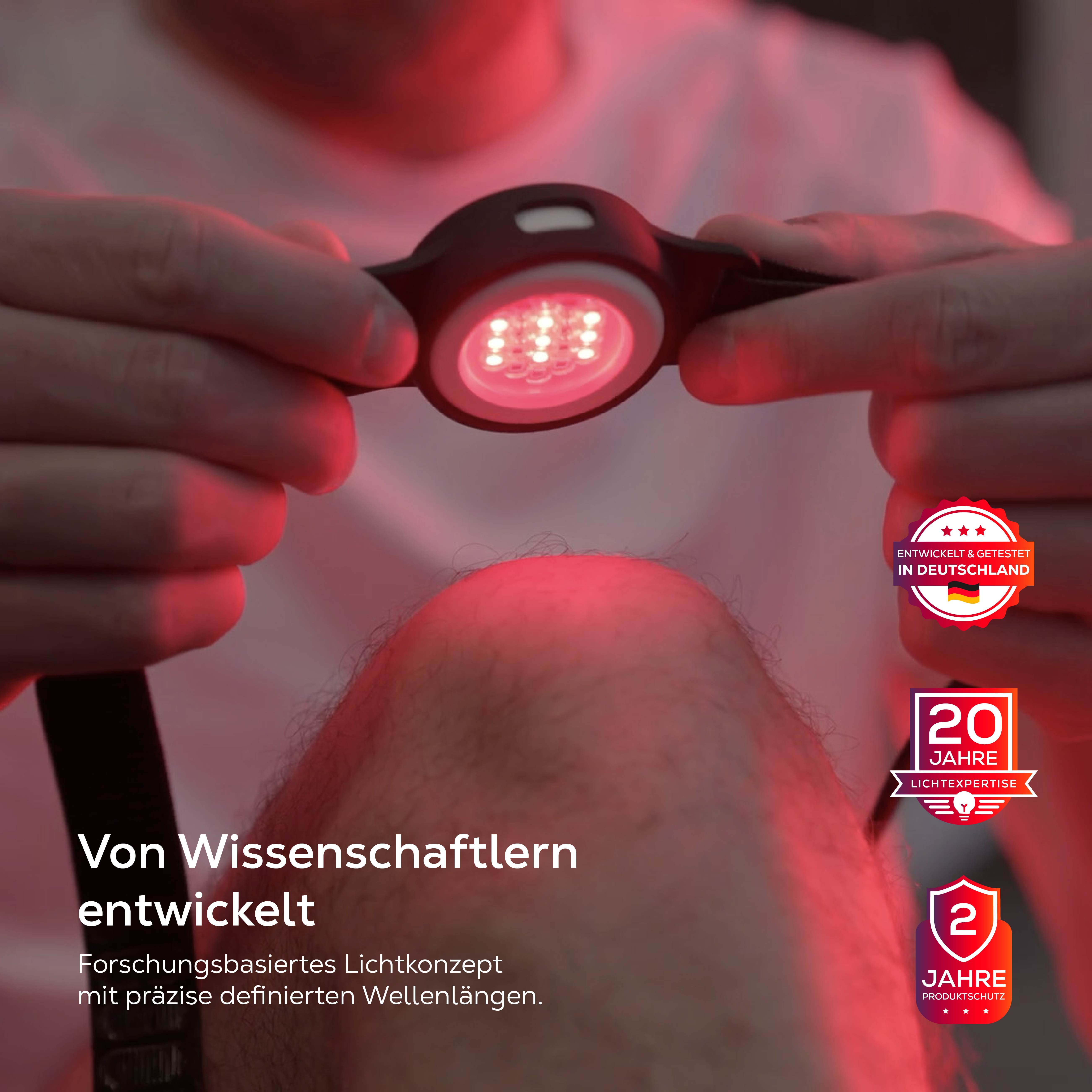 Ein Gerät mit roten LEDs wird von Händen gehalten. Es gibt eine deutsche Fahne und Schutzsiegel.