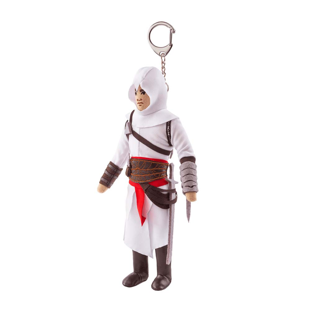 Un piccolo portachiavi di una figura con veste bianca con cappuccio, che tiene una spada.