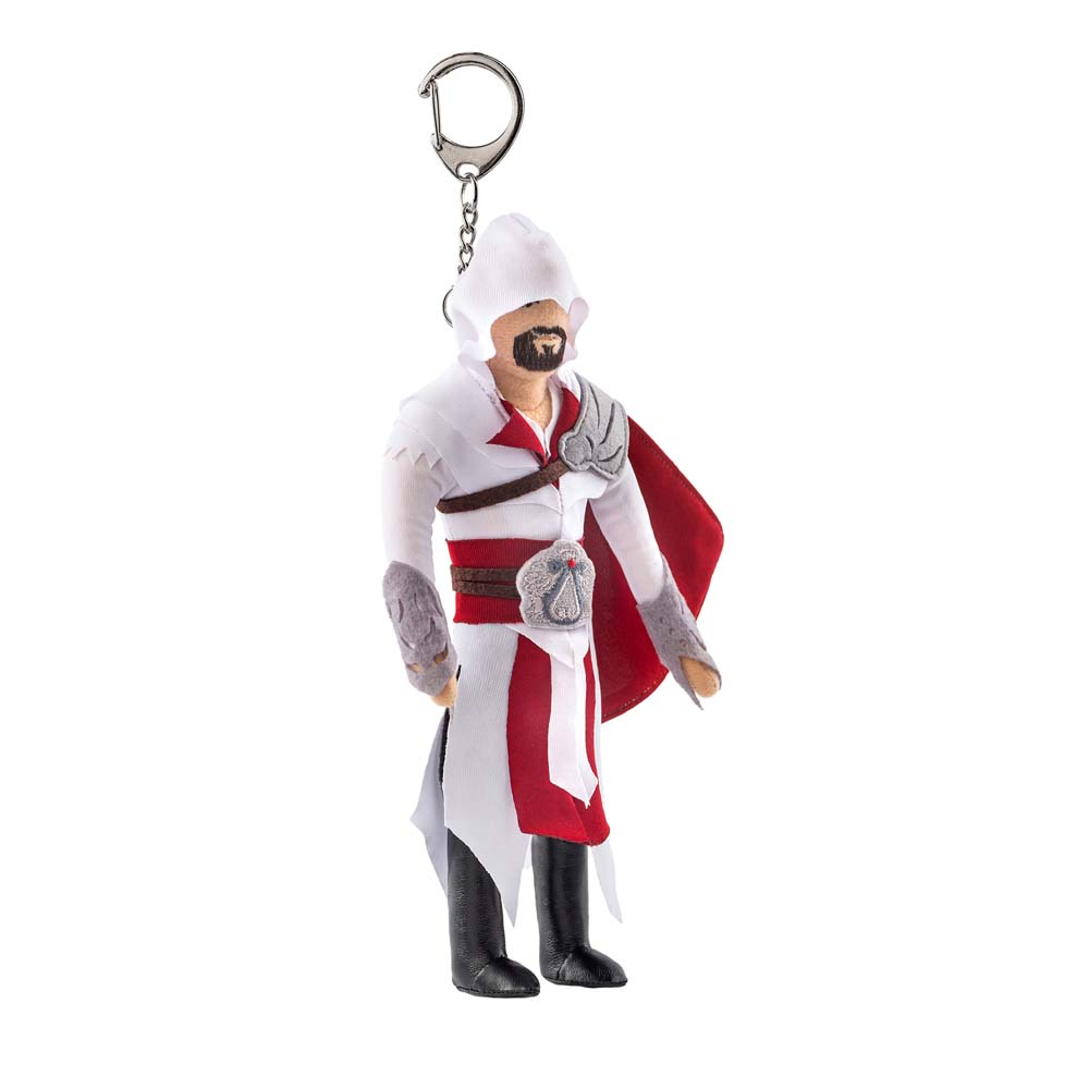 Un portachiavi con una figura in una veste bianca e rossa con cappuccio.