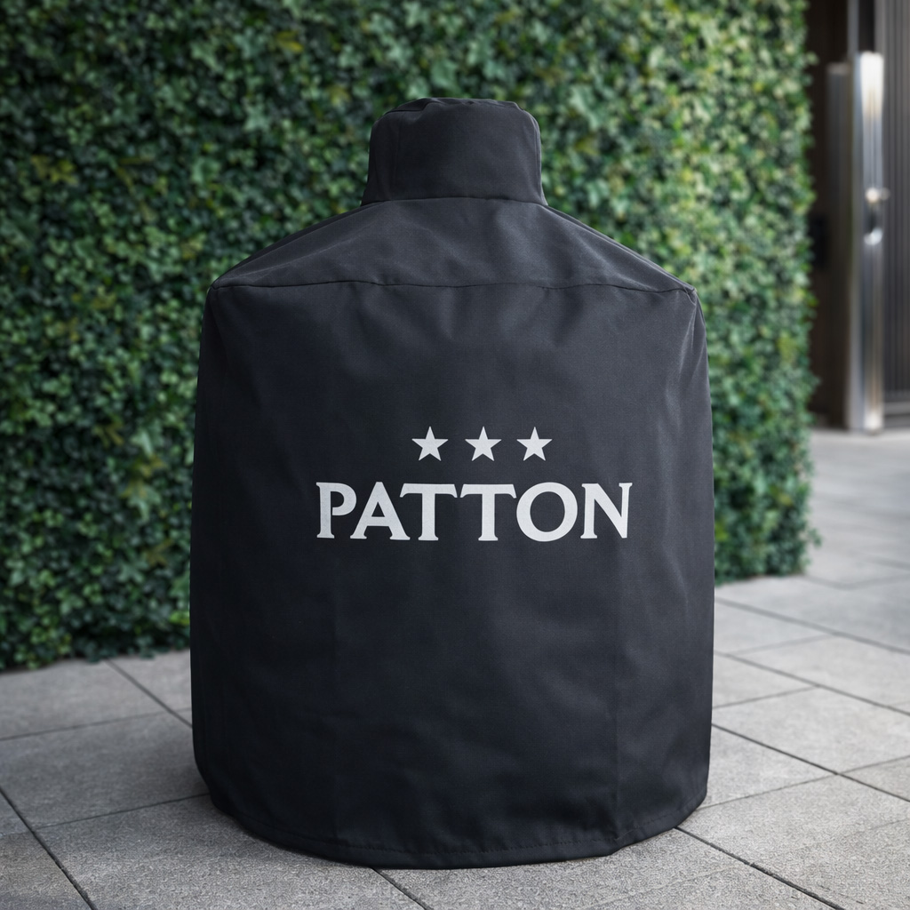 Black cover with Patton logo and three stars on paved ground.