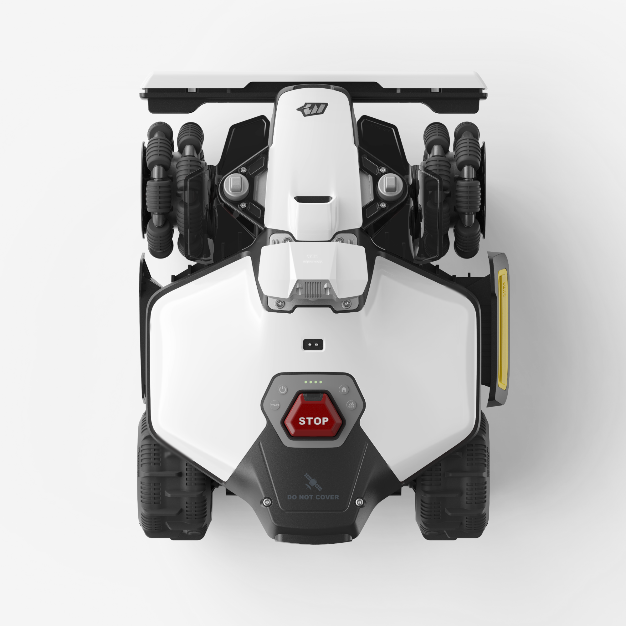 Un robot cortacésped blanco y negro con un botón de parada rojo.