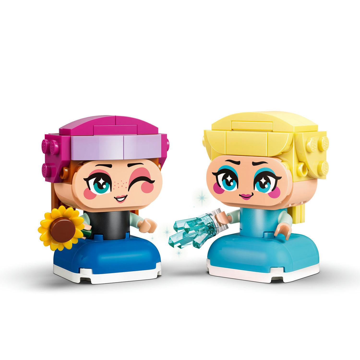İki Lego figürü: Anna ayçiçeğiyle, Elsa buz kristaliyle.