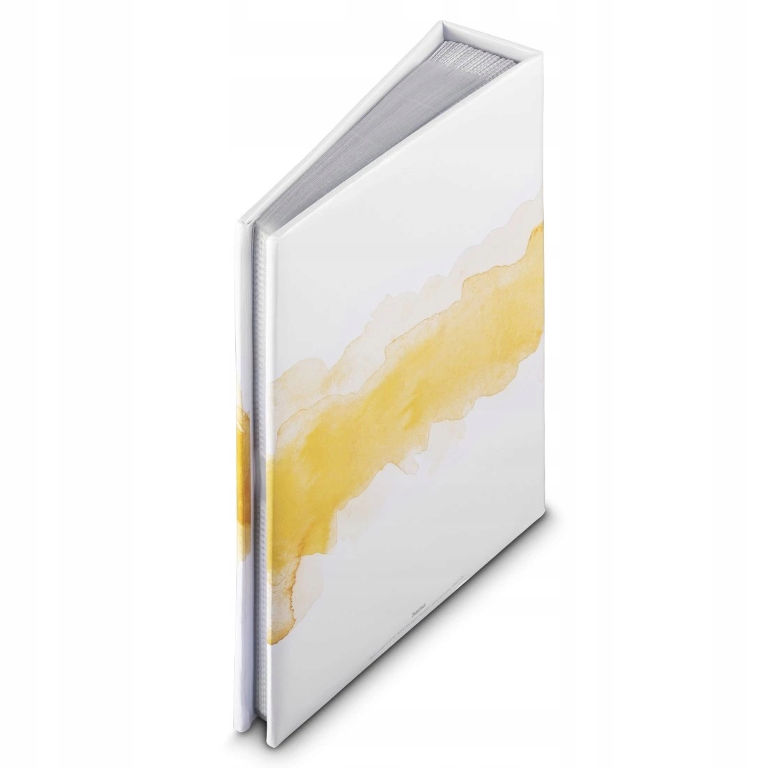 Biała książka z żółtymi plamami akwareli i srebrnymi stronami.