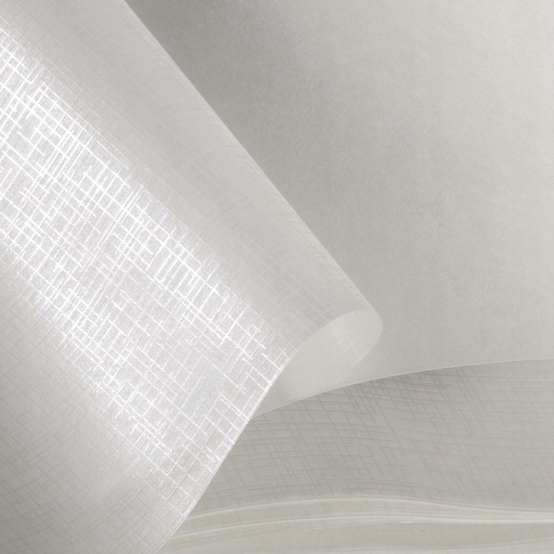 Zbliżenie białego papieru z drobnym wzorem kratki.