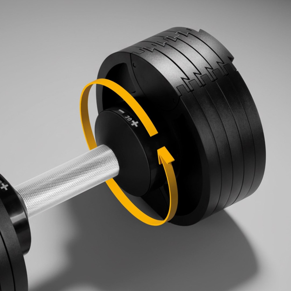 Regulowana hantla z żółtą strzałką wskazującą ruch obrotowy.