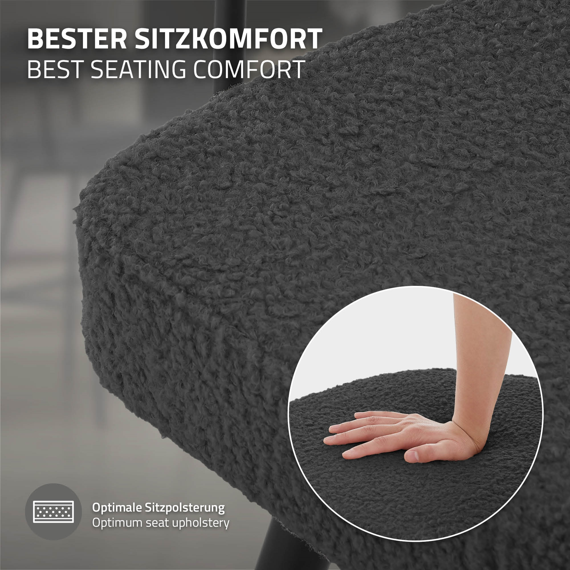 Dunkelgrauer Teddy-Stoff auf einem Stuhl mit einer Hand, die ihn berührt.