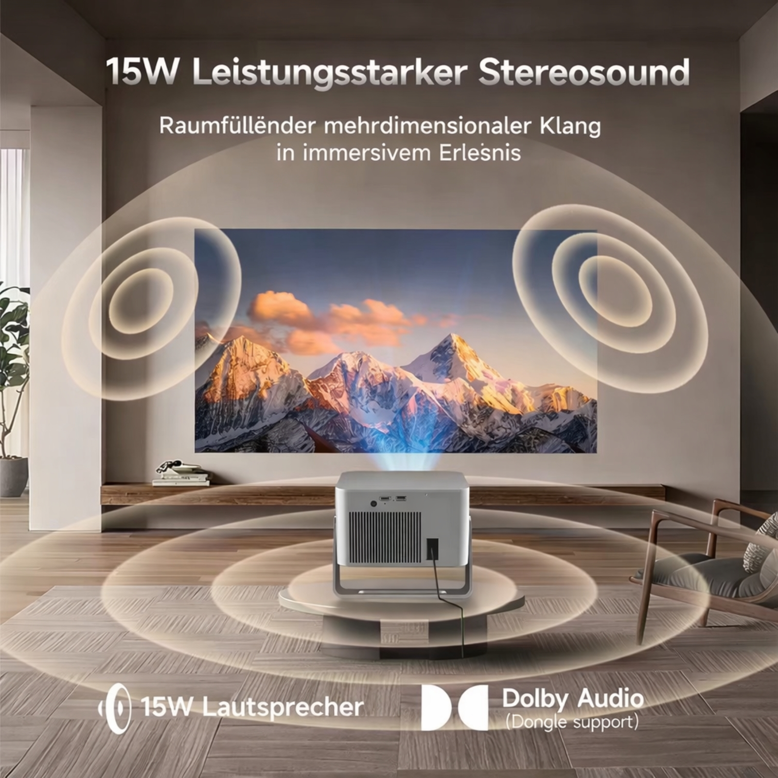 Ein Projektor zeigt eine Berglandschaft an einer Wand, mit Schallwellen, die 15W Stereosound und Dolby Audio illustrieren.