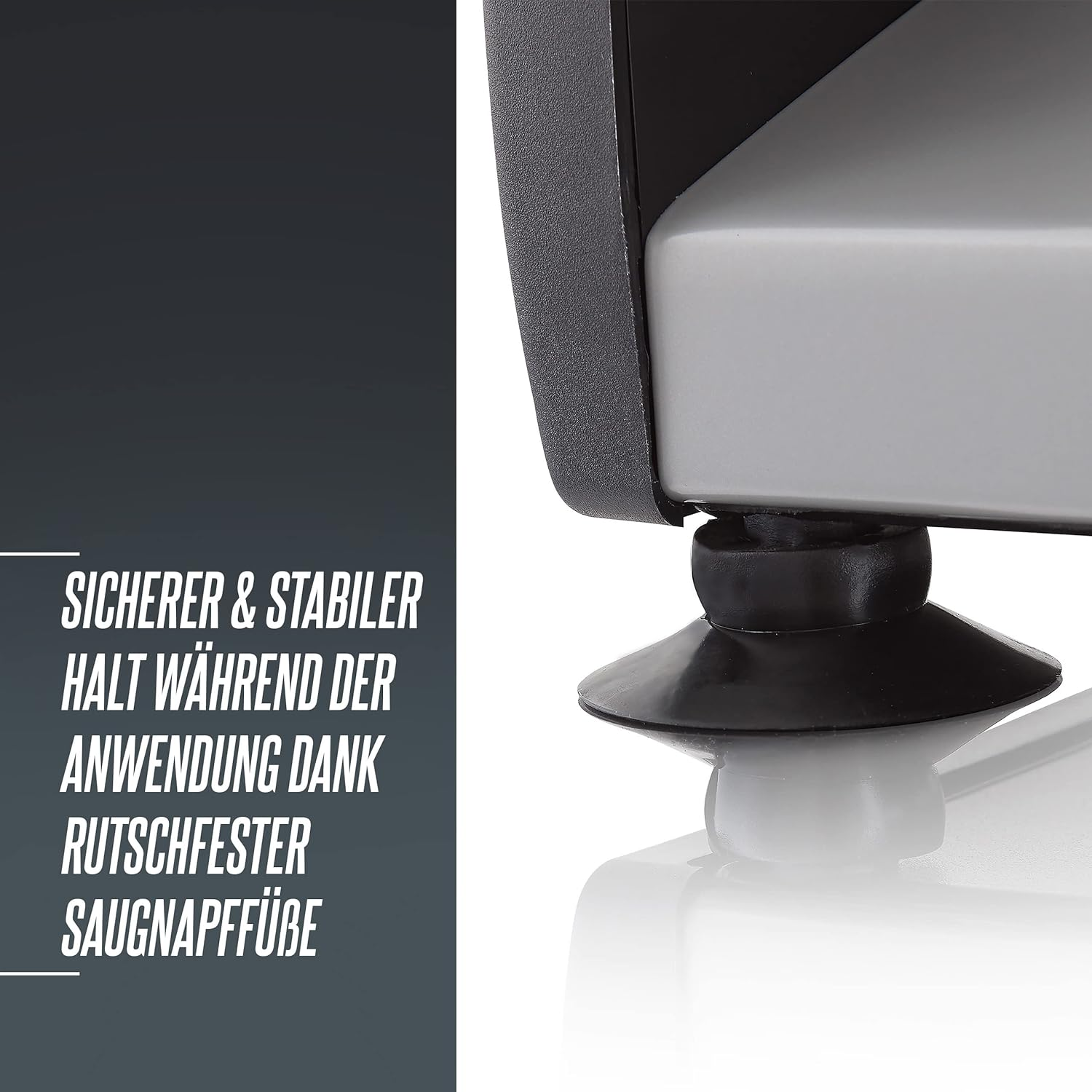 Czarna stopka z przyssawką i szeroką podstawą na szarym urządzeniu.