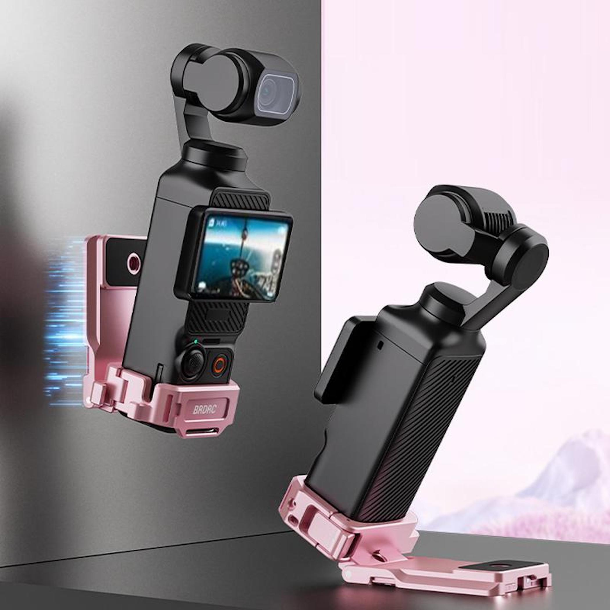Zwei schwarze Gimbal-Stabilisatoren mit rosa Halterungen auf einem Tisch.