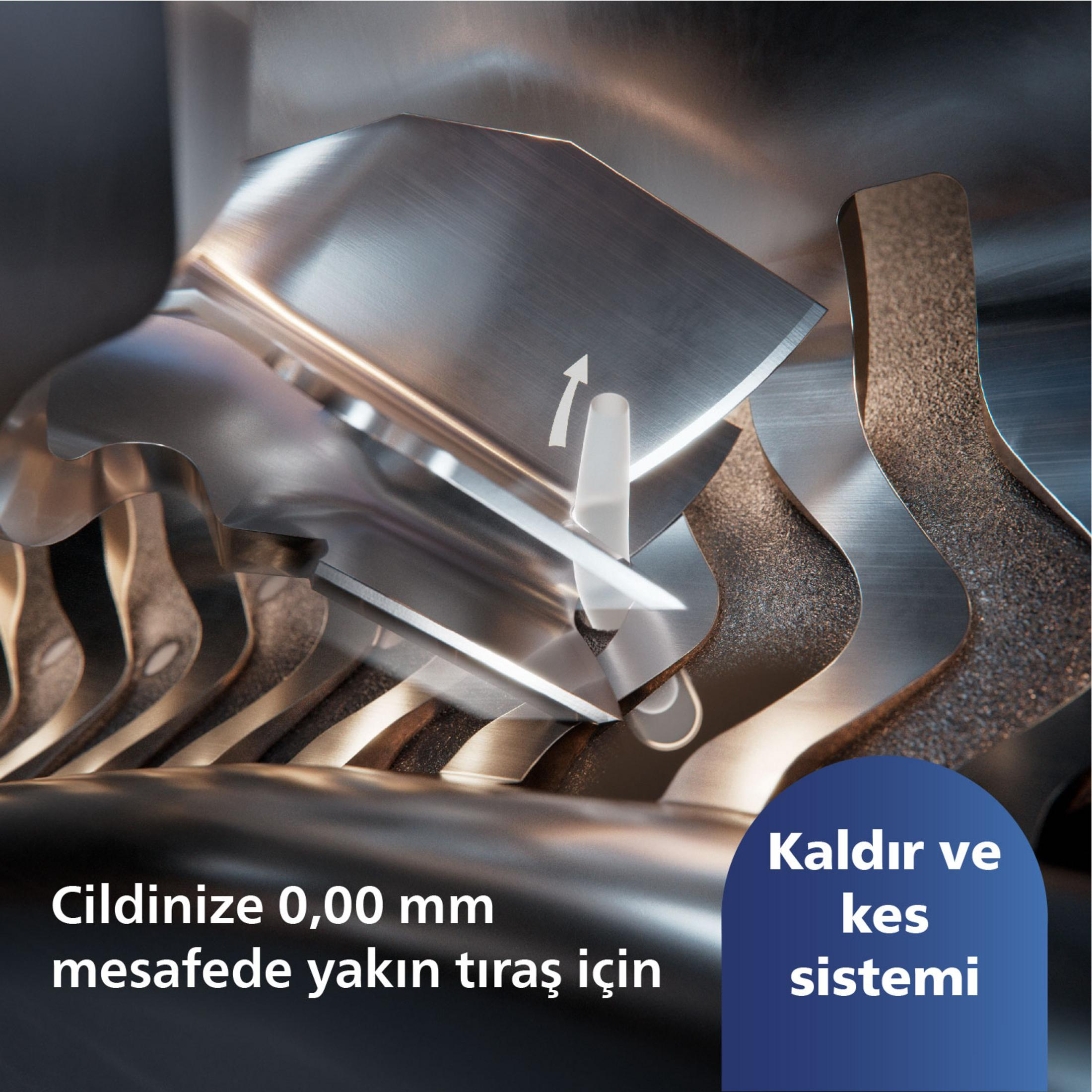 Hareket gösteren ok ile metal tıraş sisteminin yakın çekimi.