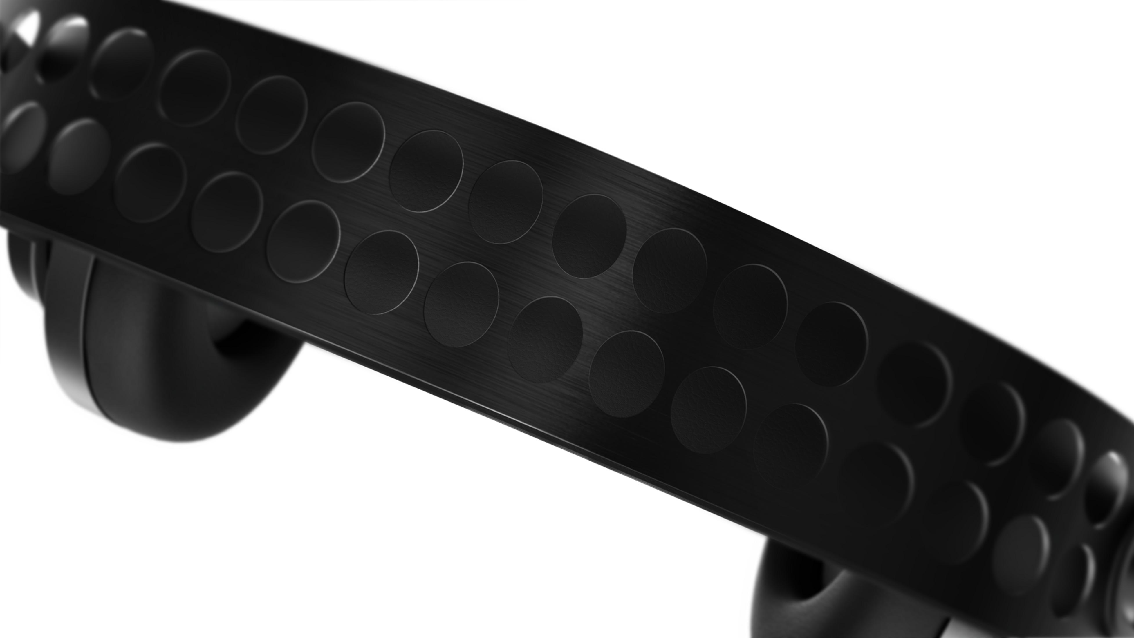 Czarna opaska na głowę z okrągłymi wycięciami, zbliżenie.