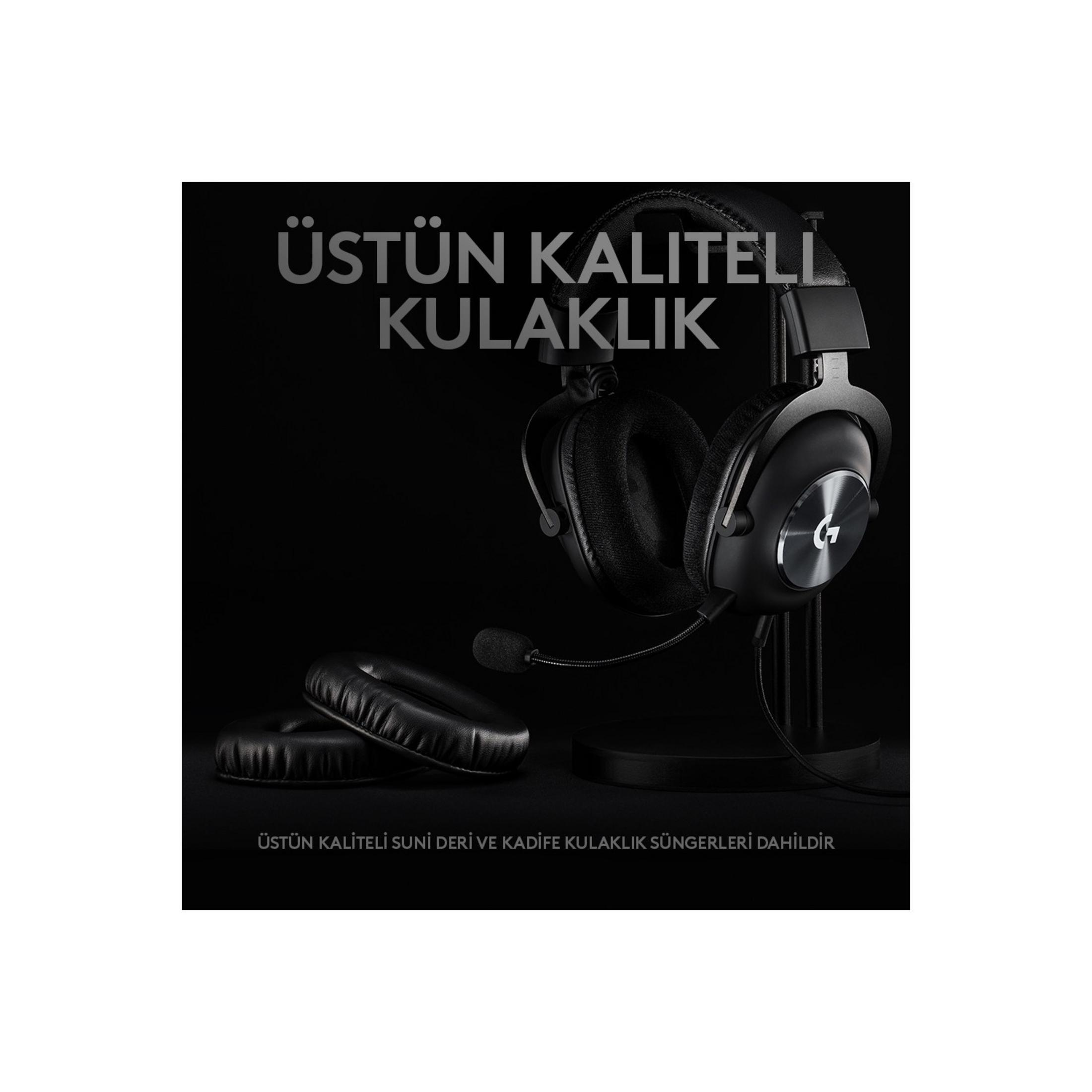 Cuffie da gaming nere con microfono su supporto, cuscinetti auricolari di ricambio accanto.