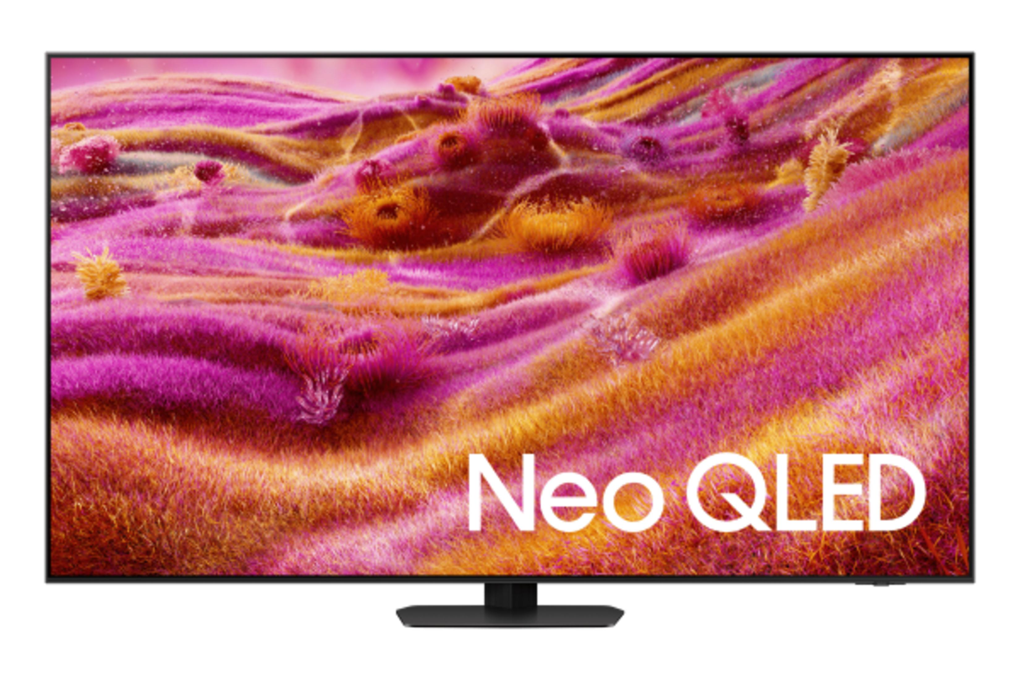Modern bir TV, pembe ve turuncu renklerde soyut bir manzara gösteriyor.