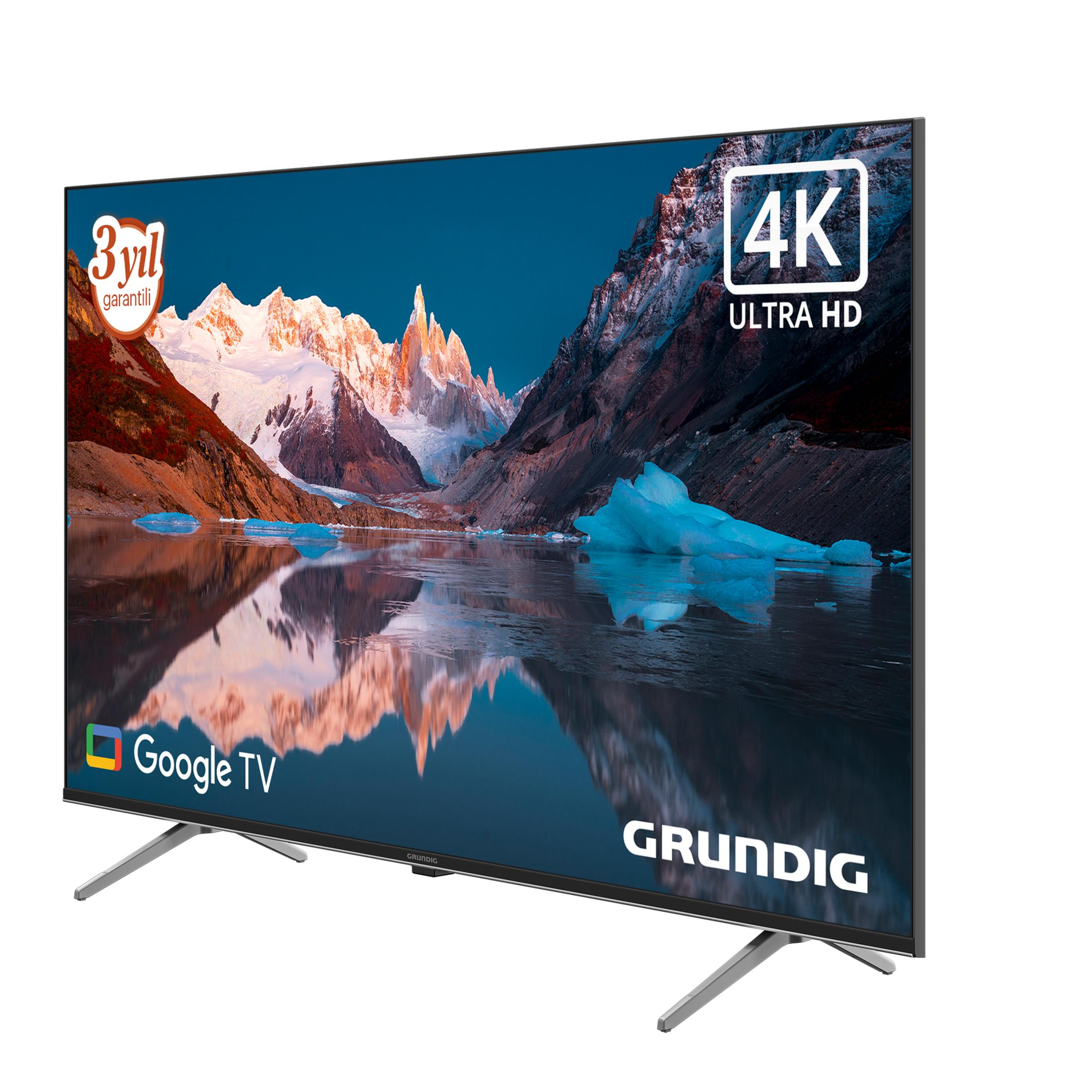 Modern bir Grundig TV, 4K Ultra HD ve Google TV özellikli, stant üzerinde.