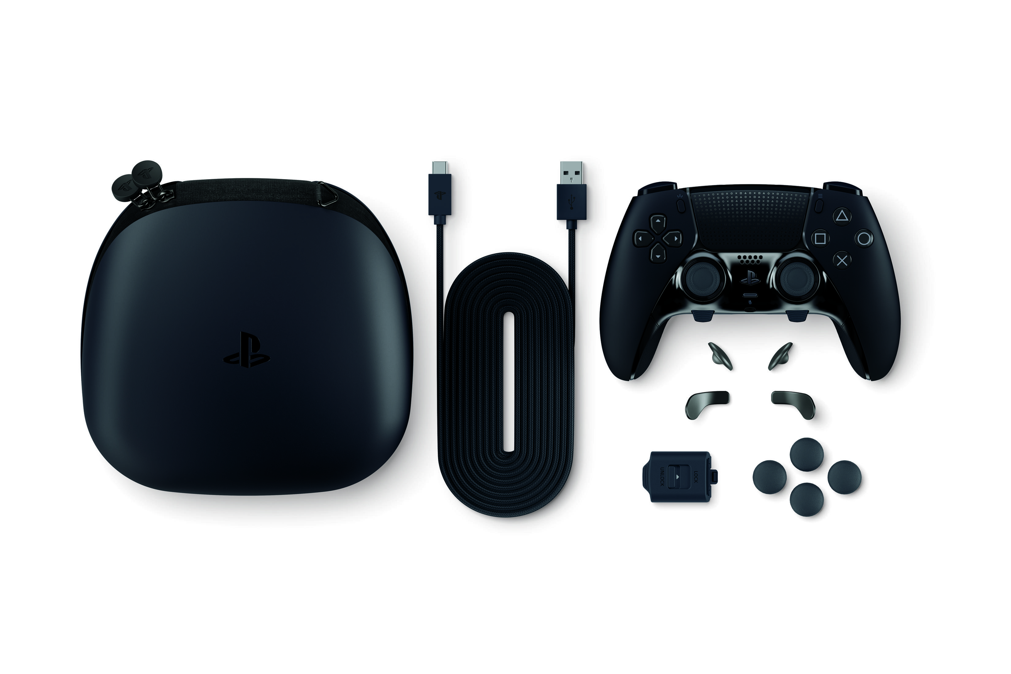 Accessori da gioco neri: controller, custodia, cavo e parti.
