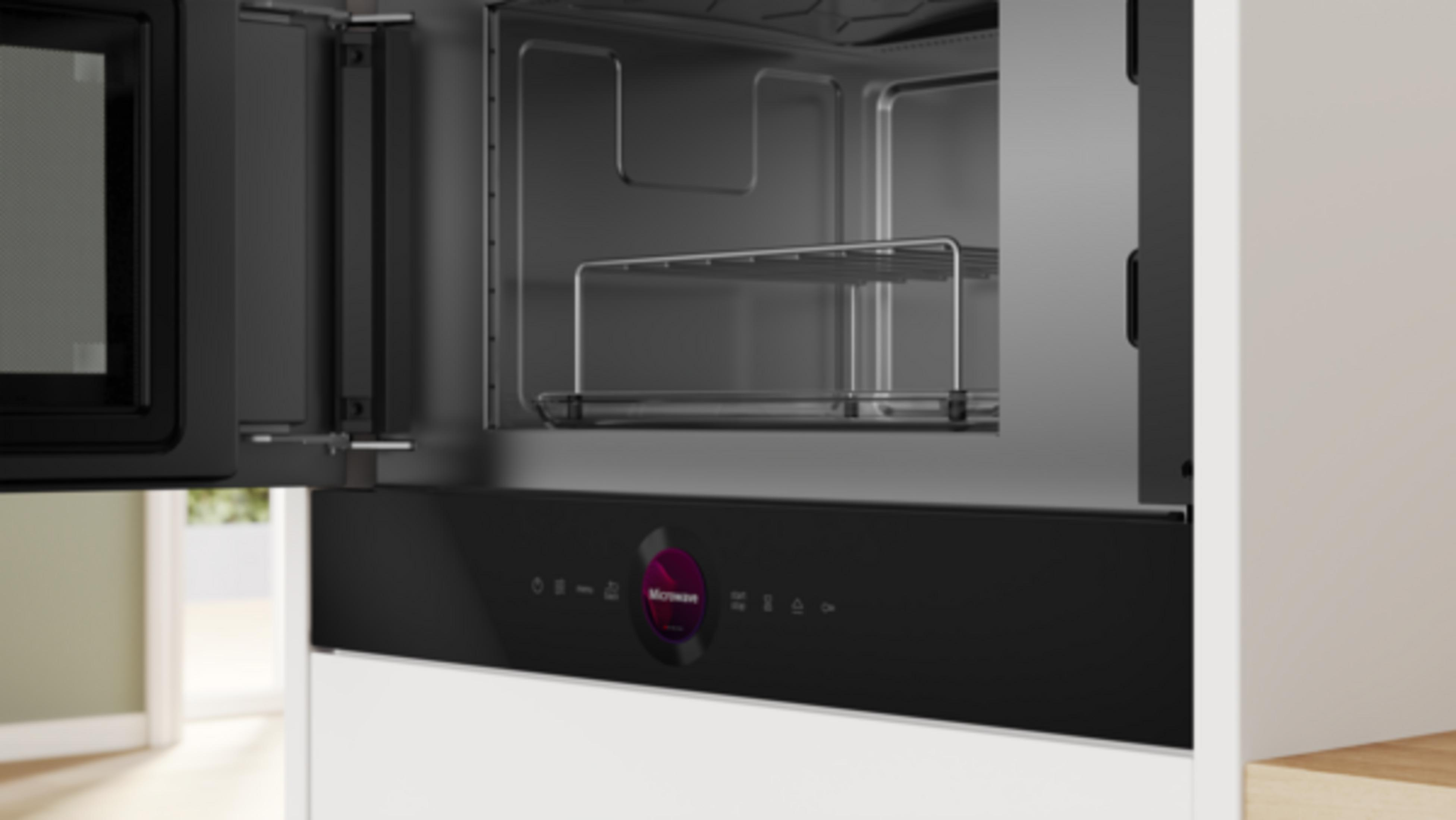 Otwarta kuchenka mikrofalowa z rusztem i panelem sterowania dotykowego.