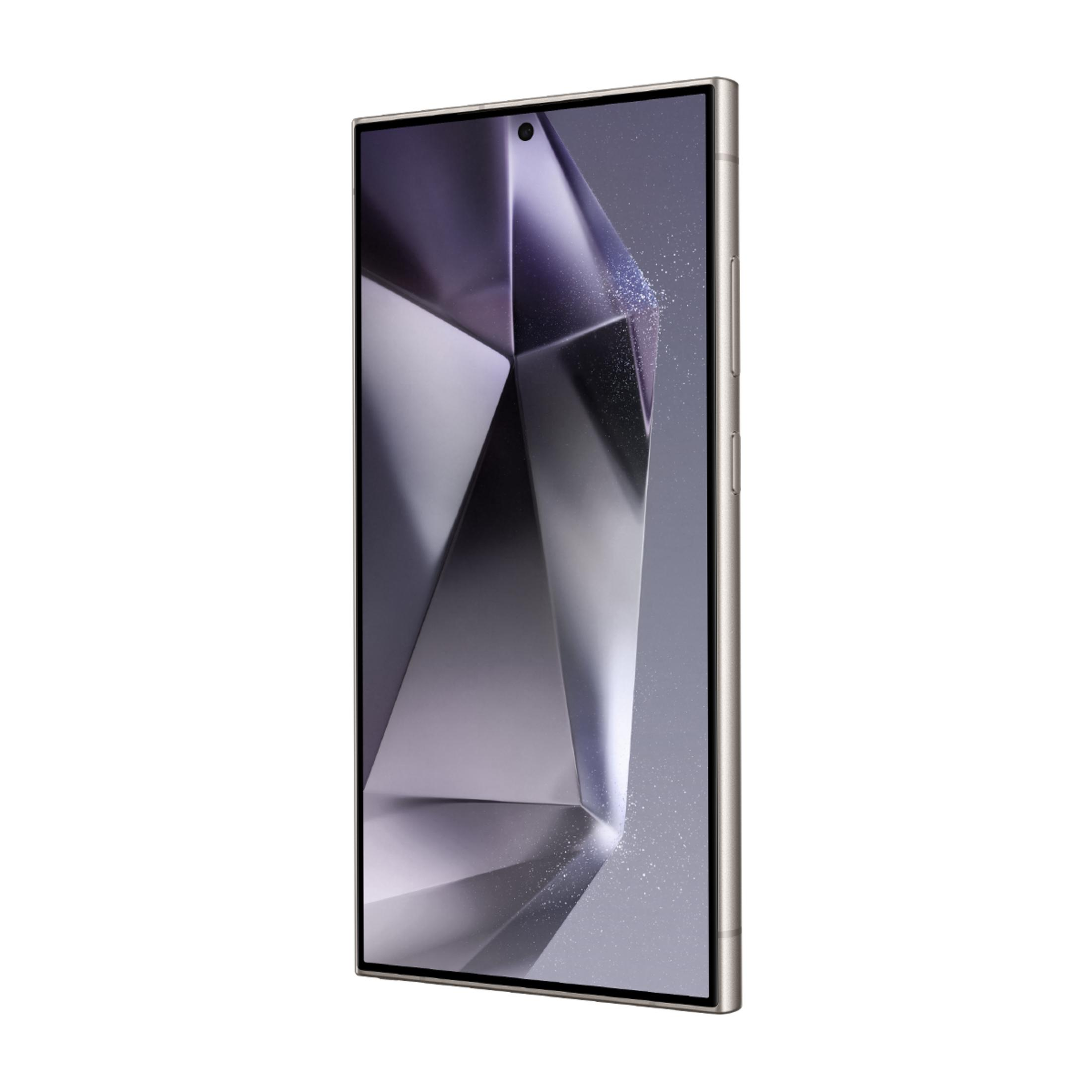 Geometrik arka planlı altın rengi akıllı telefon.