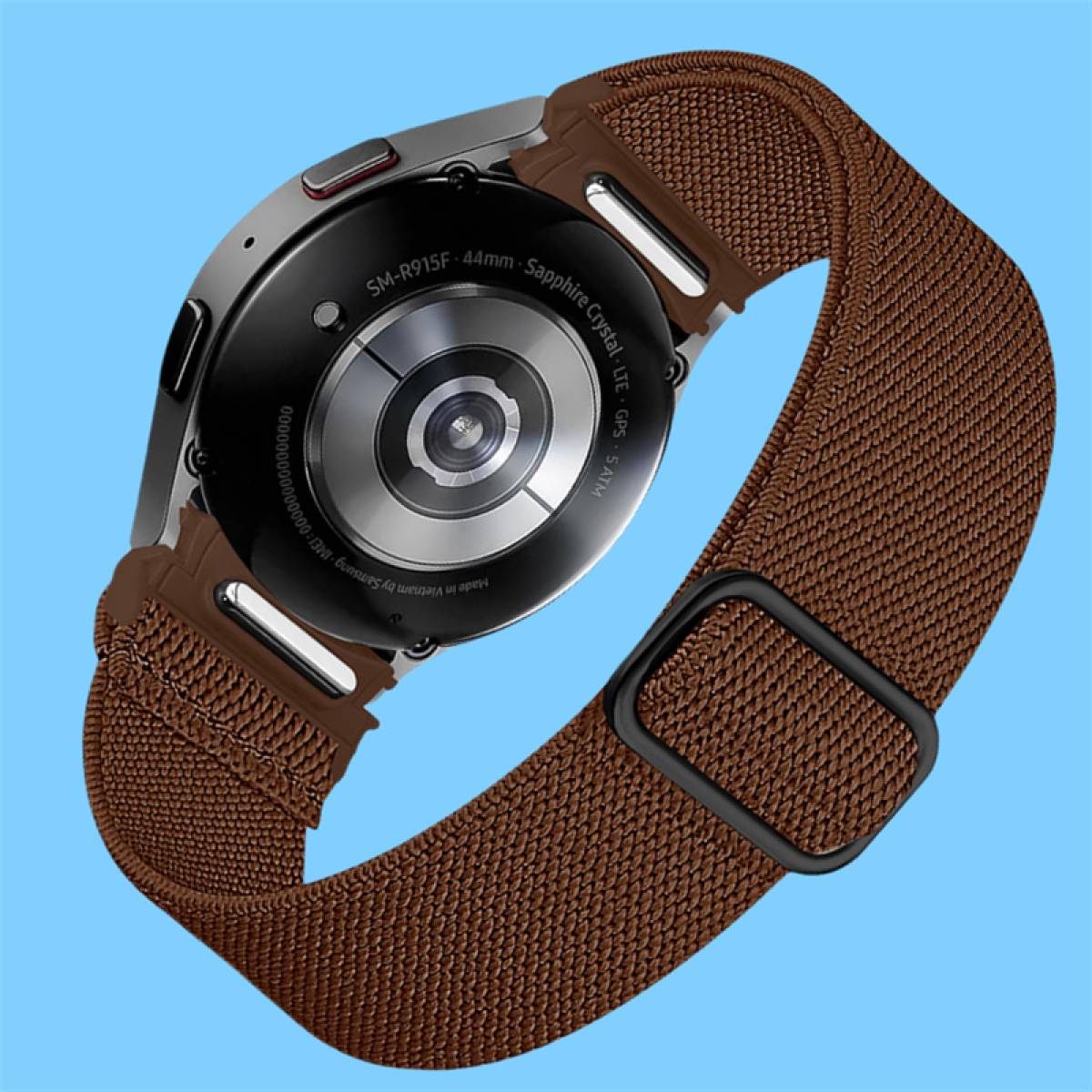 Rückseite einer silbernen Smartwatch mit braunem Stoffarmband und schwarzem Verschluss.
