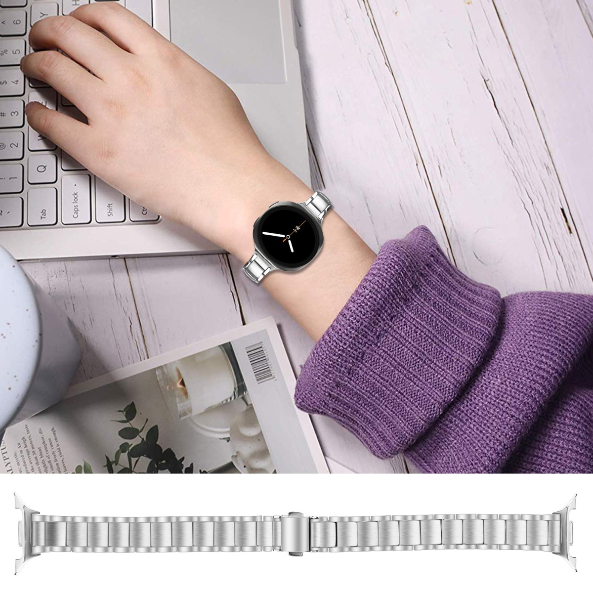 Eine Person tippt auf einer Tastatur, trägt eine Smartwatch mit silbernem Armband.