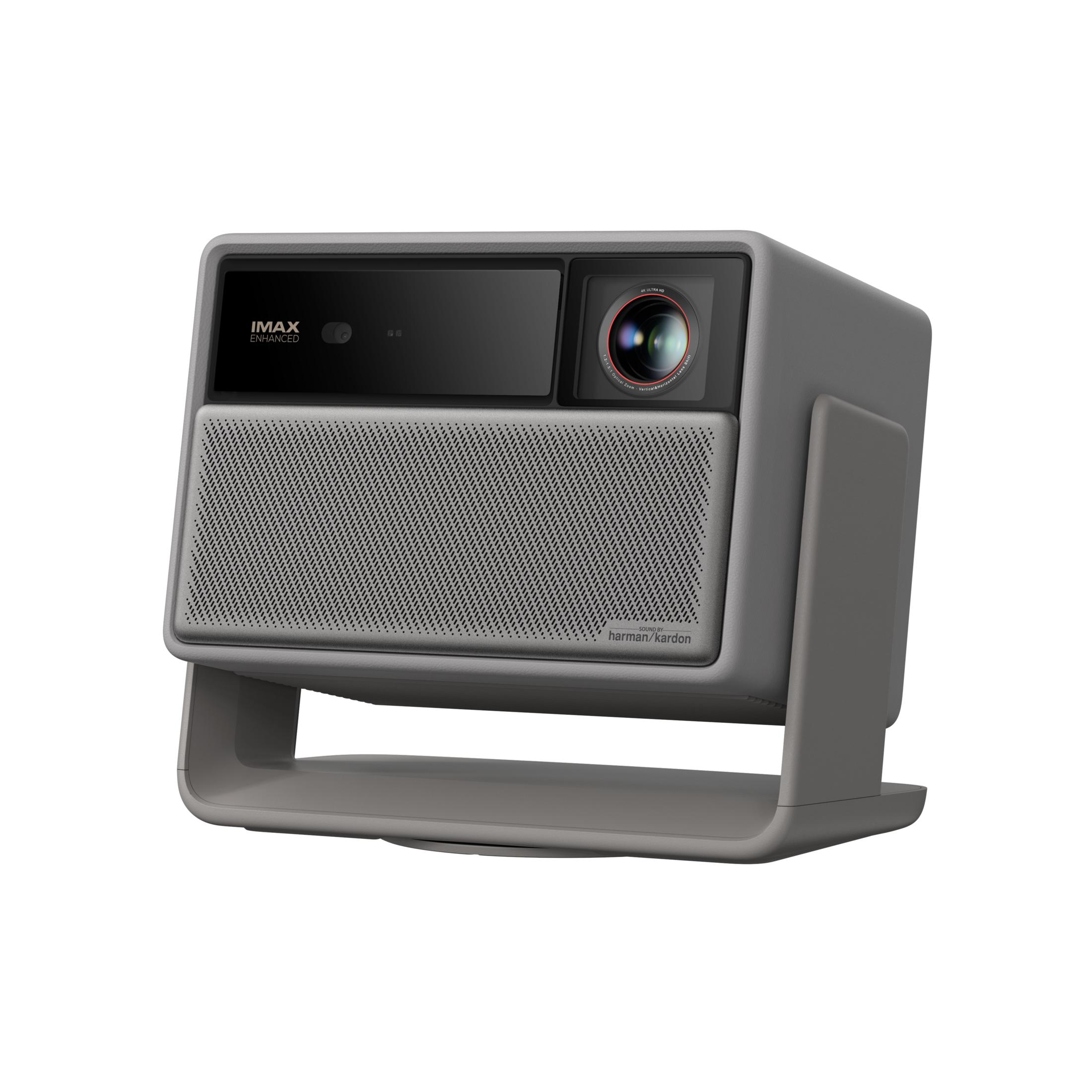 Gray projector with IMAX logo, lens, and Harman Kardon speaker.
