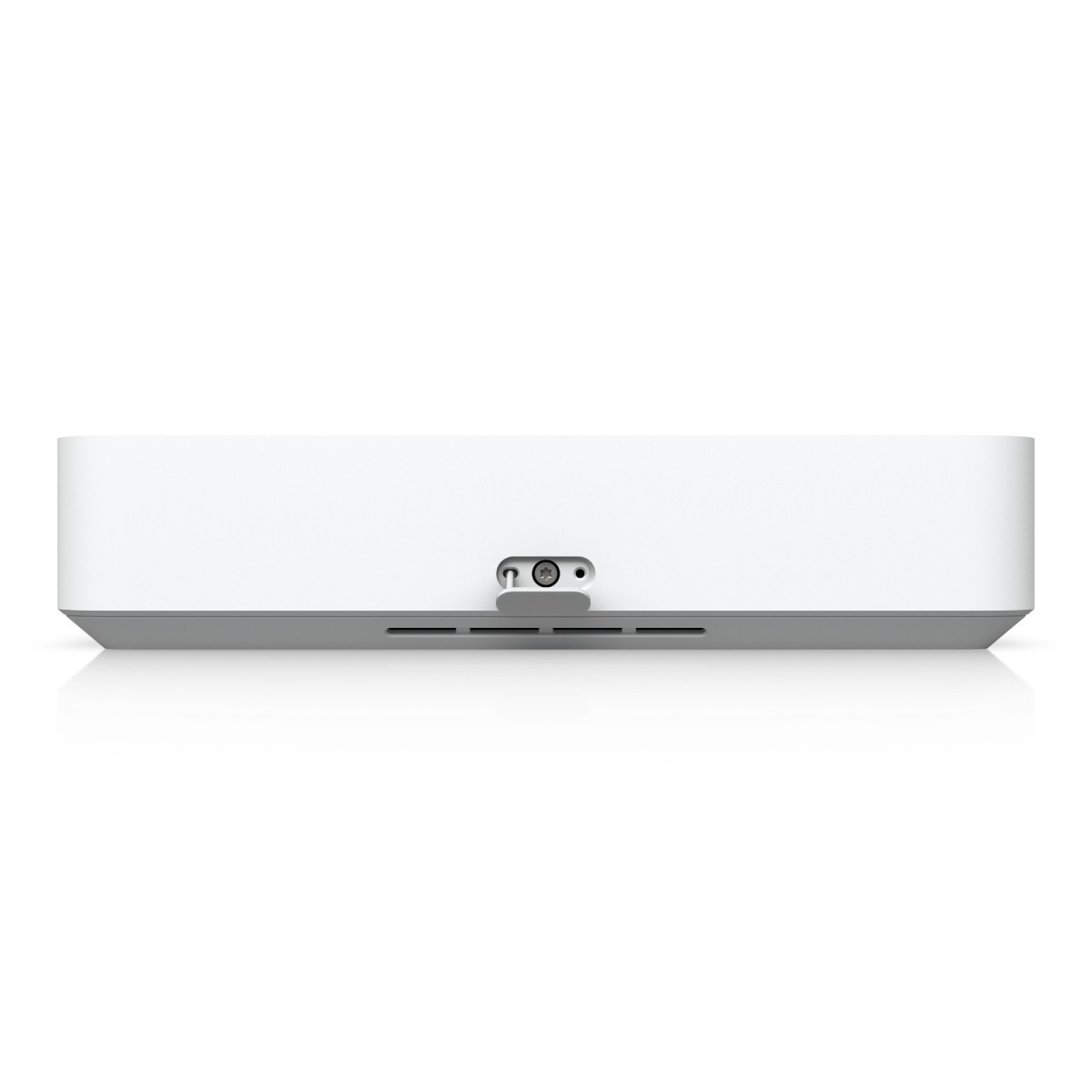 Białe pudełko z szarym spodem i portami.