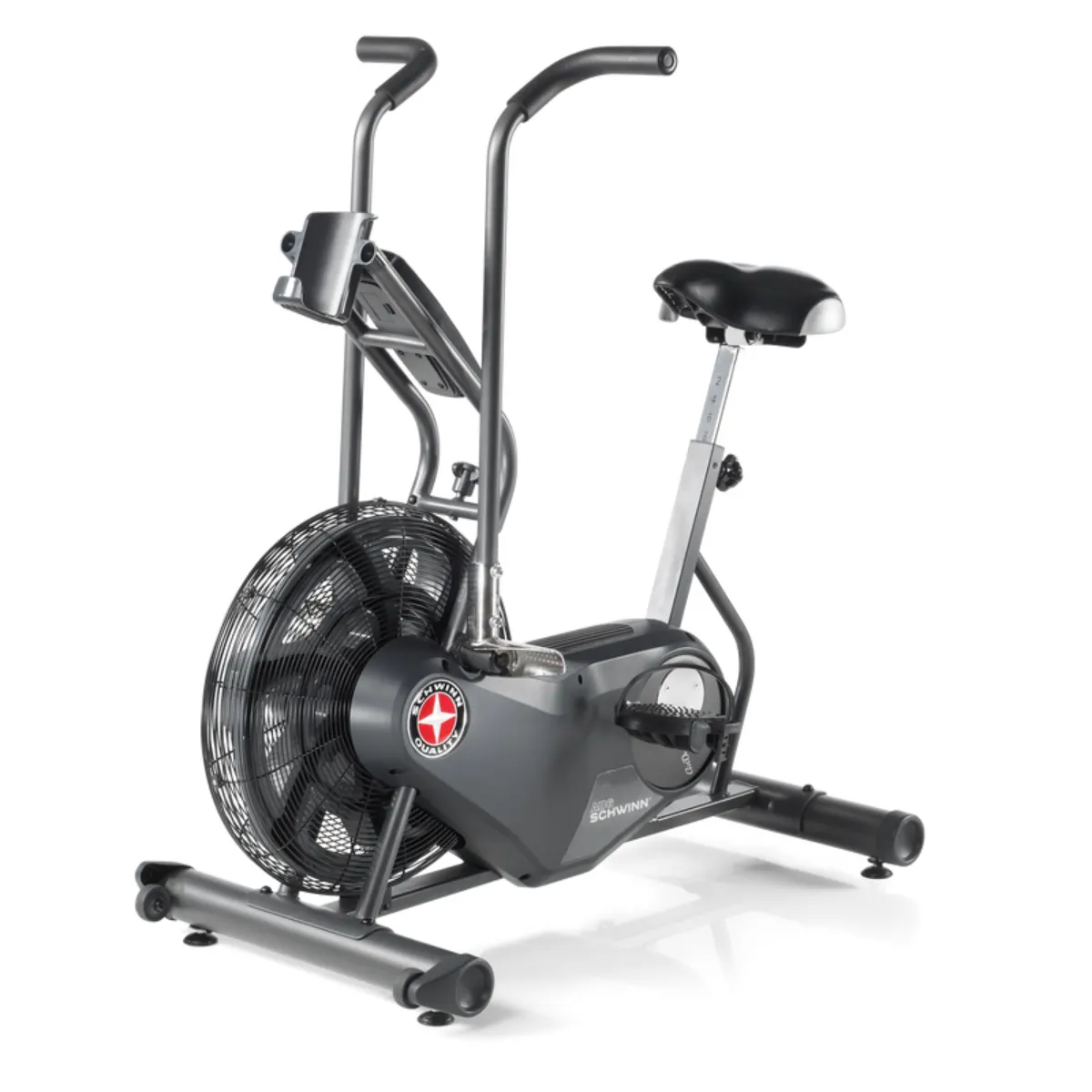 Un vélo d'appartement gris foncé avec un grand ventilateur à l'avant et un siège noir.