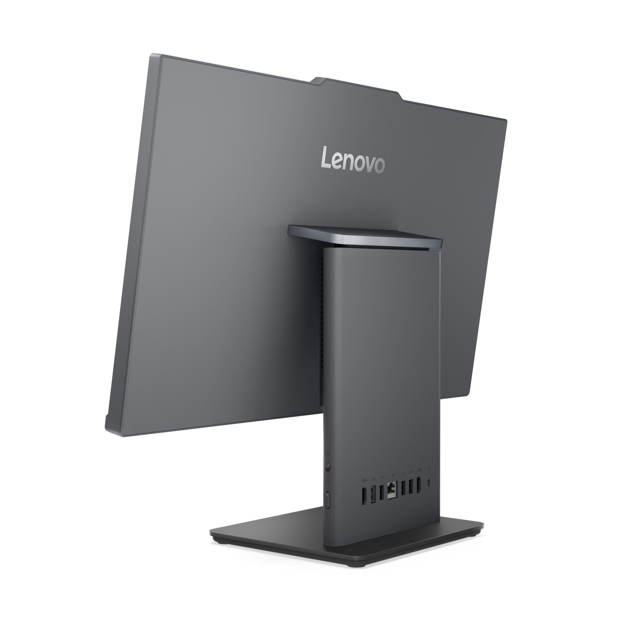 Vista posteriore di un computer desktop all-in-one grigio scuro con logo Lenovo, porte e una robusta base rettangolare.