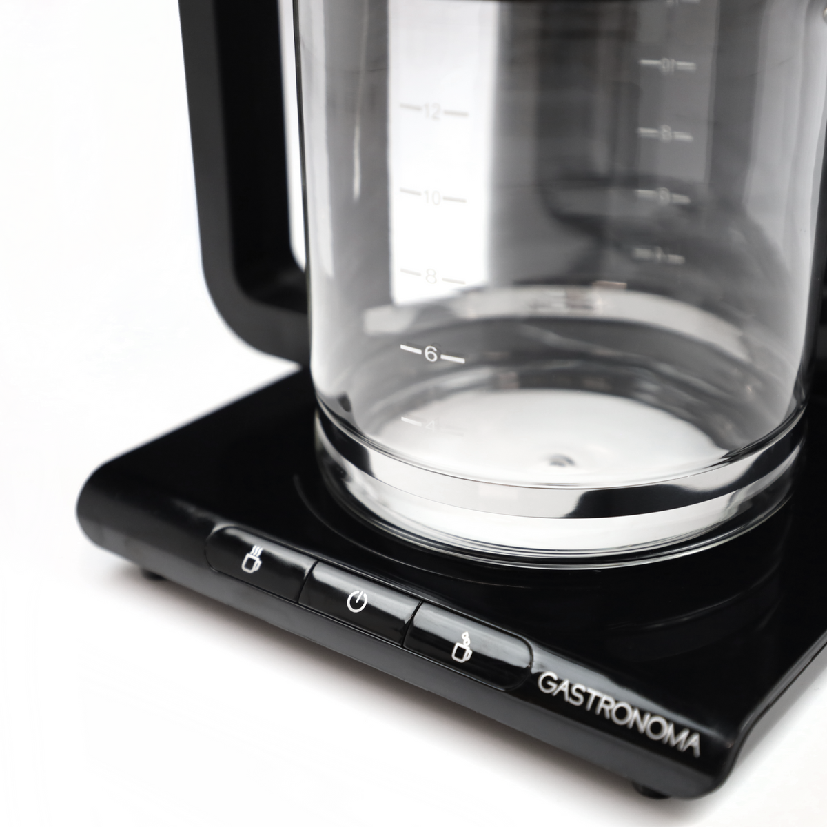 Close-up of a black coffee maker with a glass carafe and control buttons.