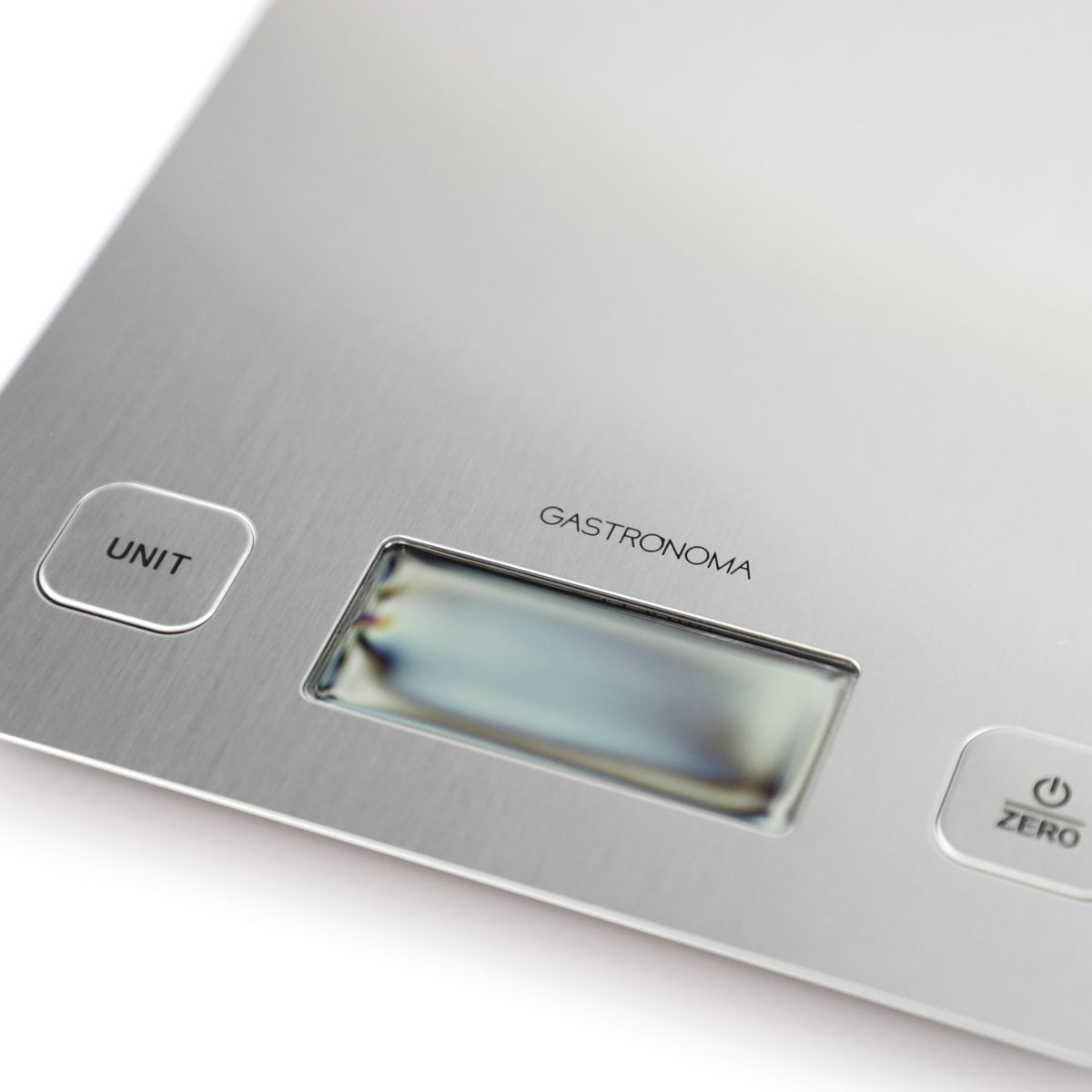 Zbliżenie srebrnej cyfrowej wagi kuchennej z przyciskiem 'UNIT' i wyświetlaczem.