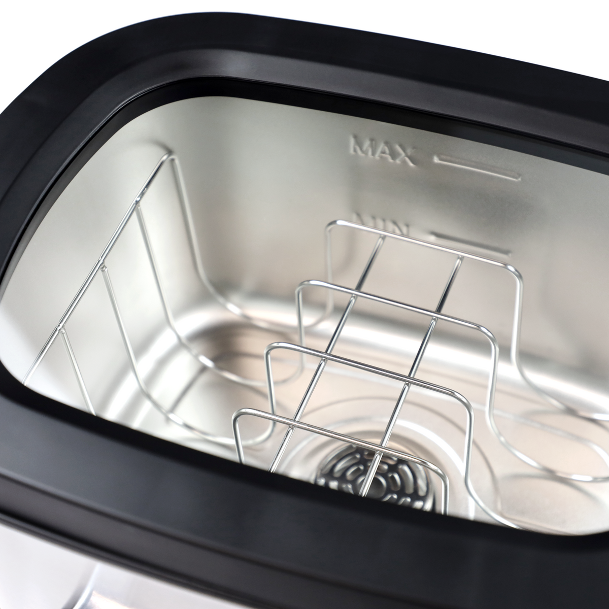 An empty, silver rack with multiple levels inside a black rim.