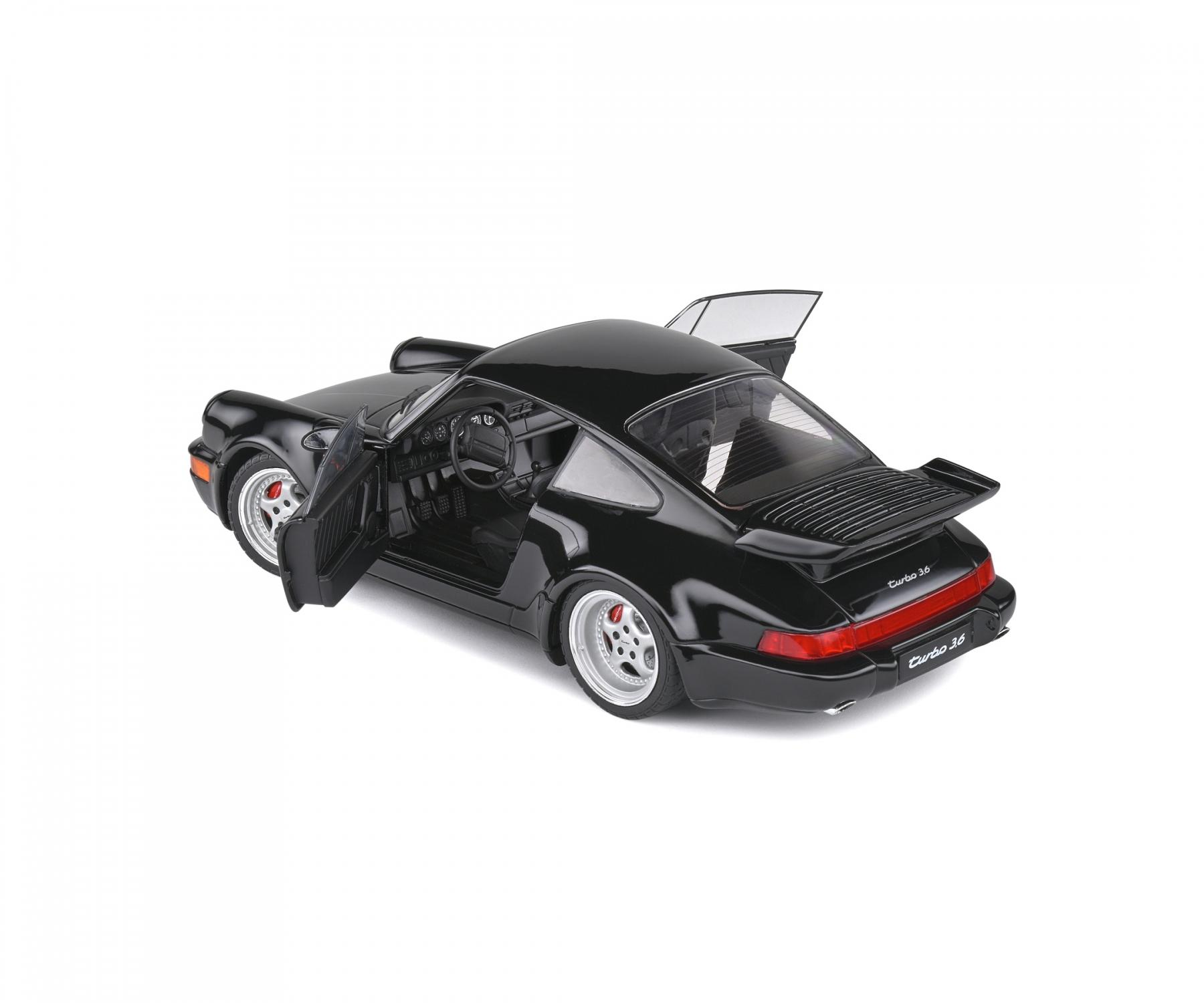 Schwarzer Porsche Turbo 3.6 Modellauto mit geöffneten Türen, silbernen Felgen, weißem Hintergrund.