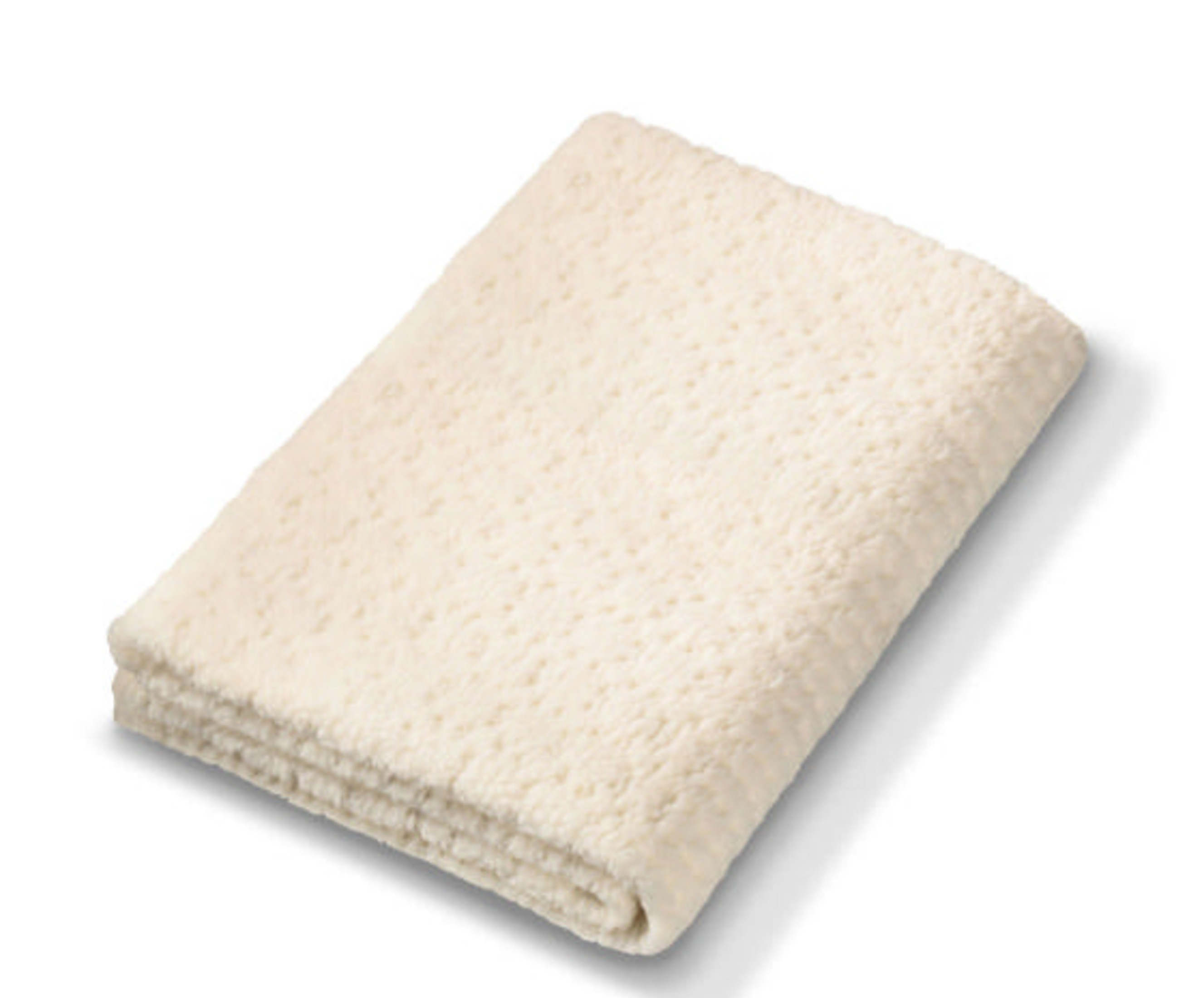 Ein gefalteter cremefarbener Teppich mit Muster.