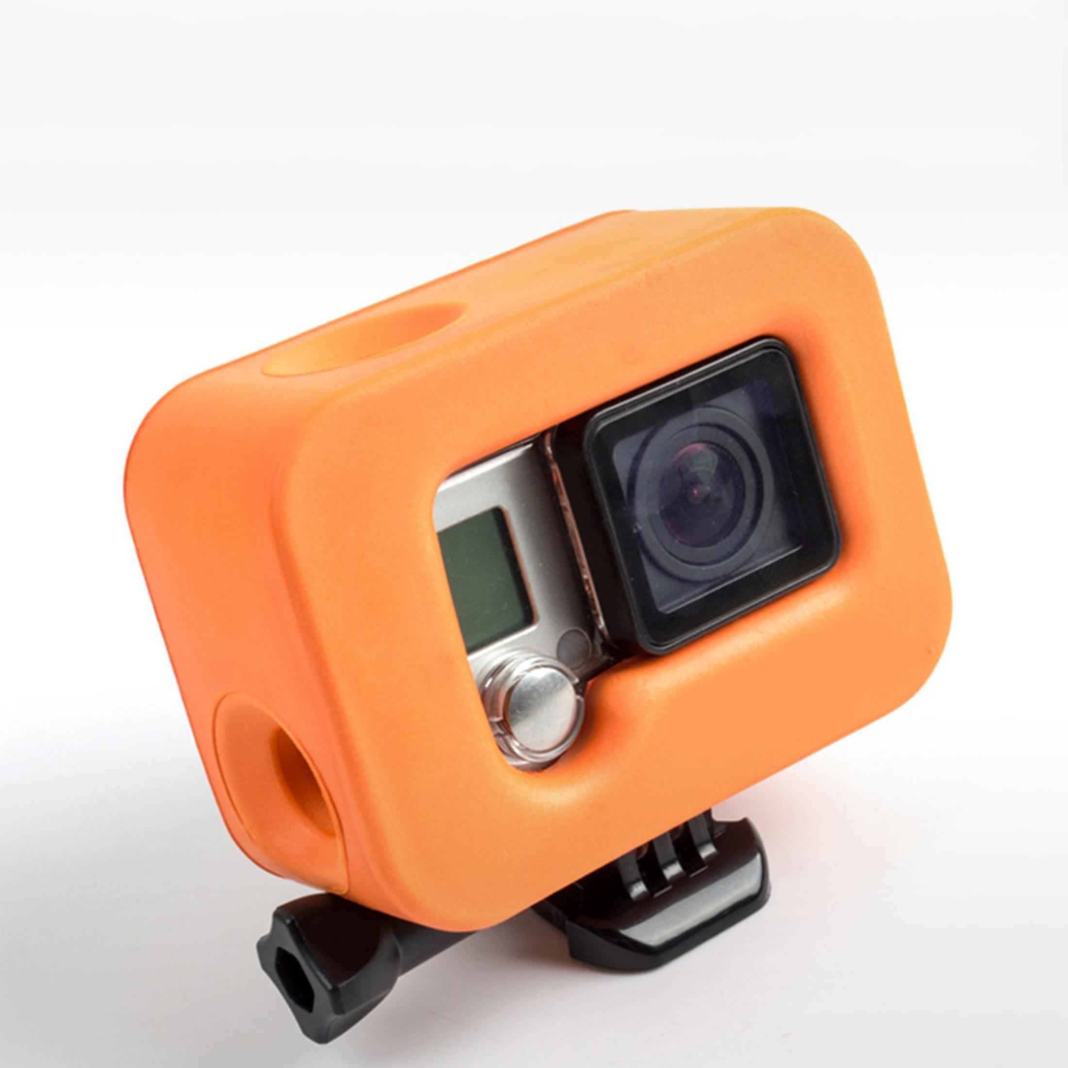 Custodia protettiva arancione per action camera con obiettivo e display.