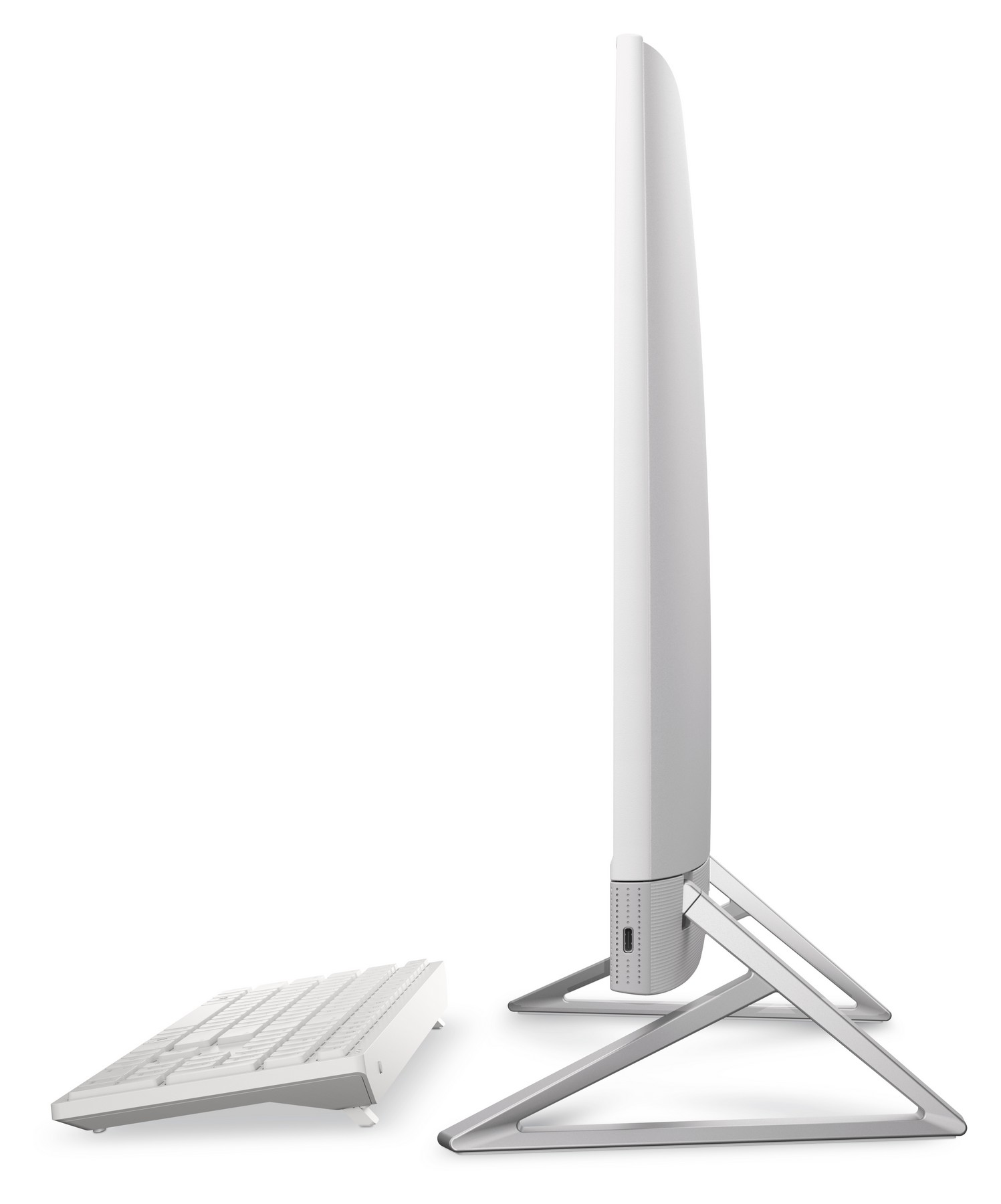 Un monitor di computer bianco con supporto argentato e tastiera bianca.