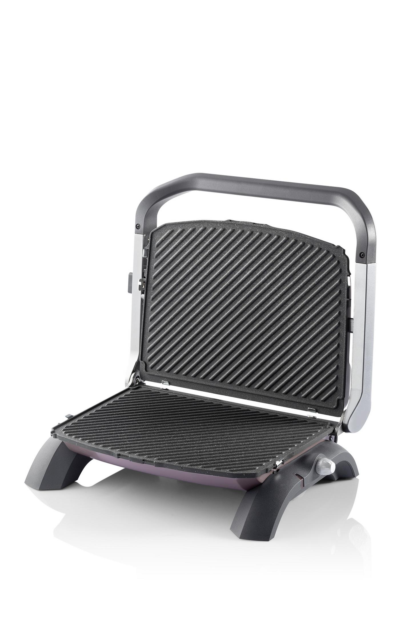 Ein offener Kontaktgrill mit gerippten Platten und einem schwarzen Griff.