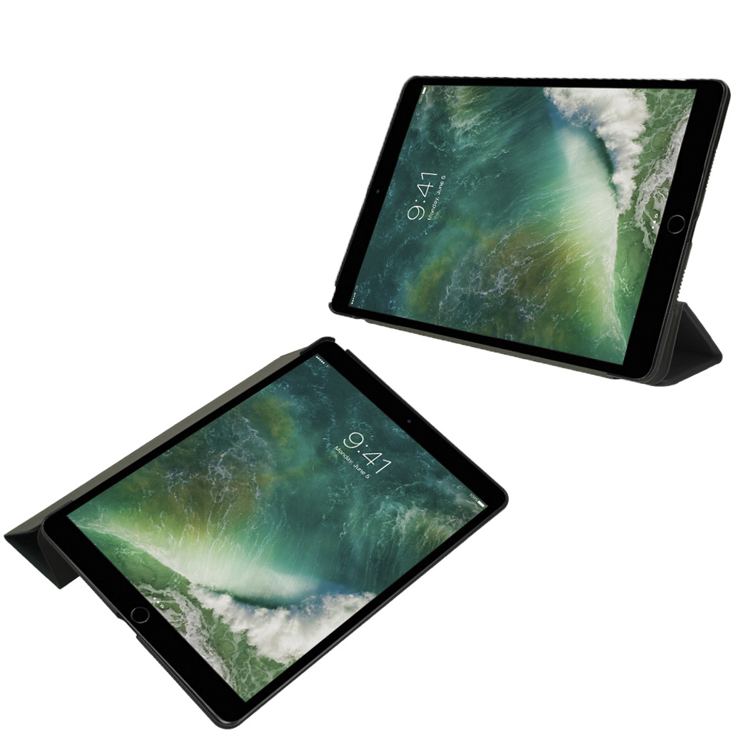 Two tablets in dark cases, displaying a green wallpaper on a white background.