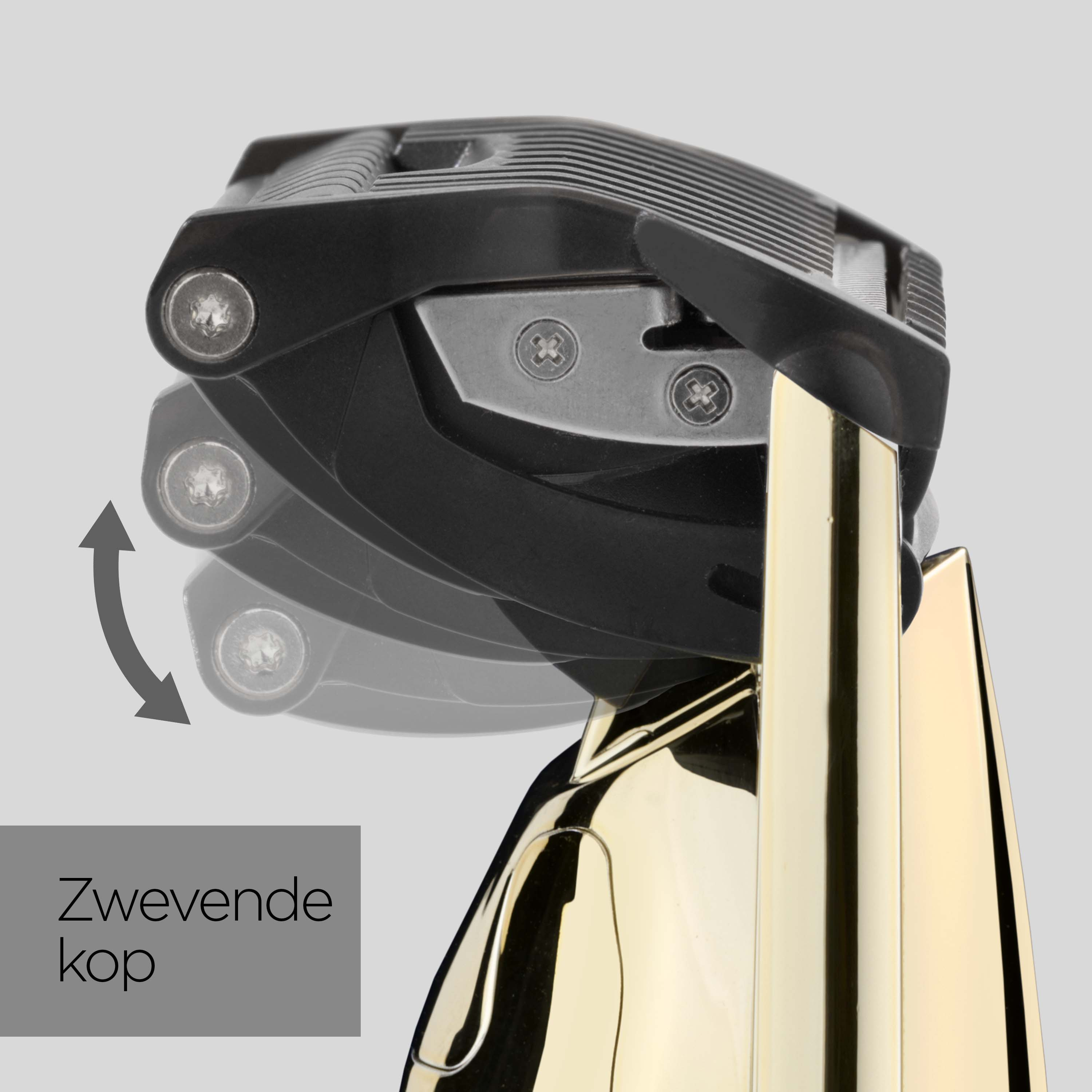 Close-up of a pivoting black shaver head with a gold handle.