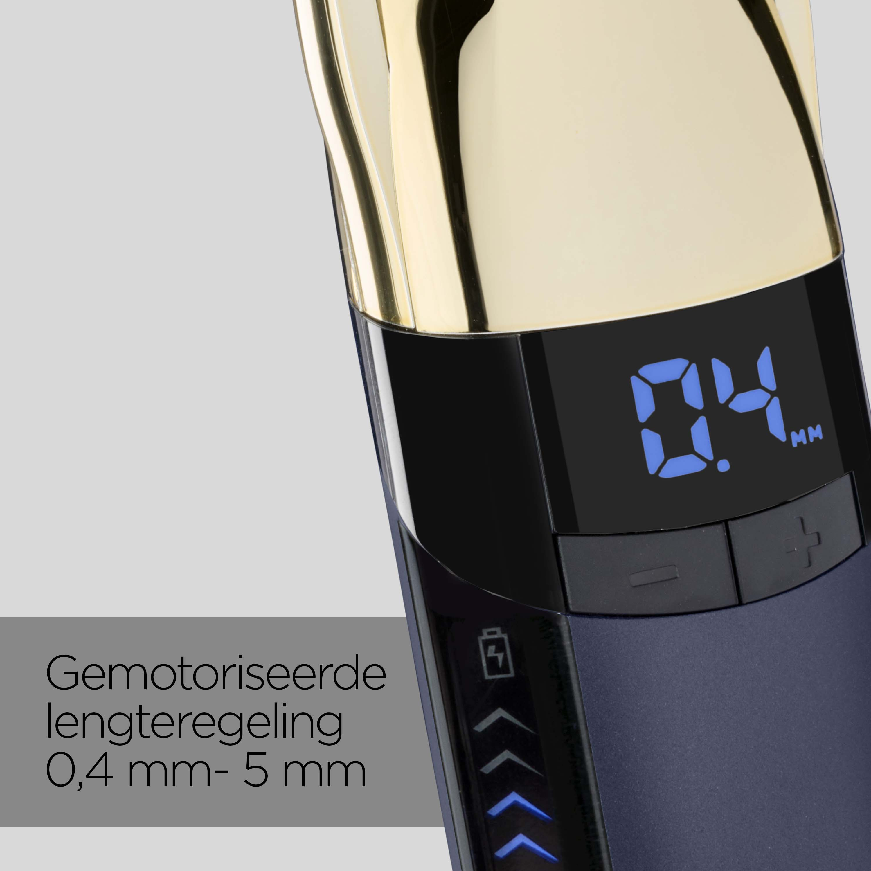 Close up of a dark trimmer with a gold top and digital display.