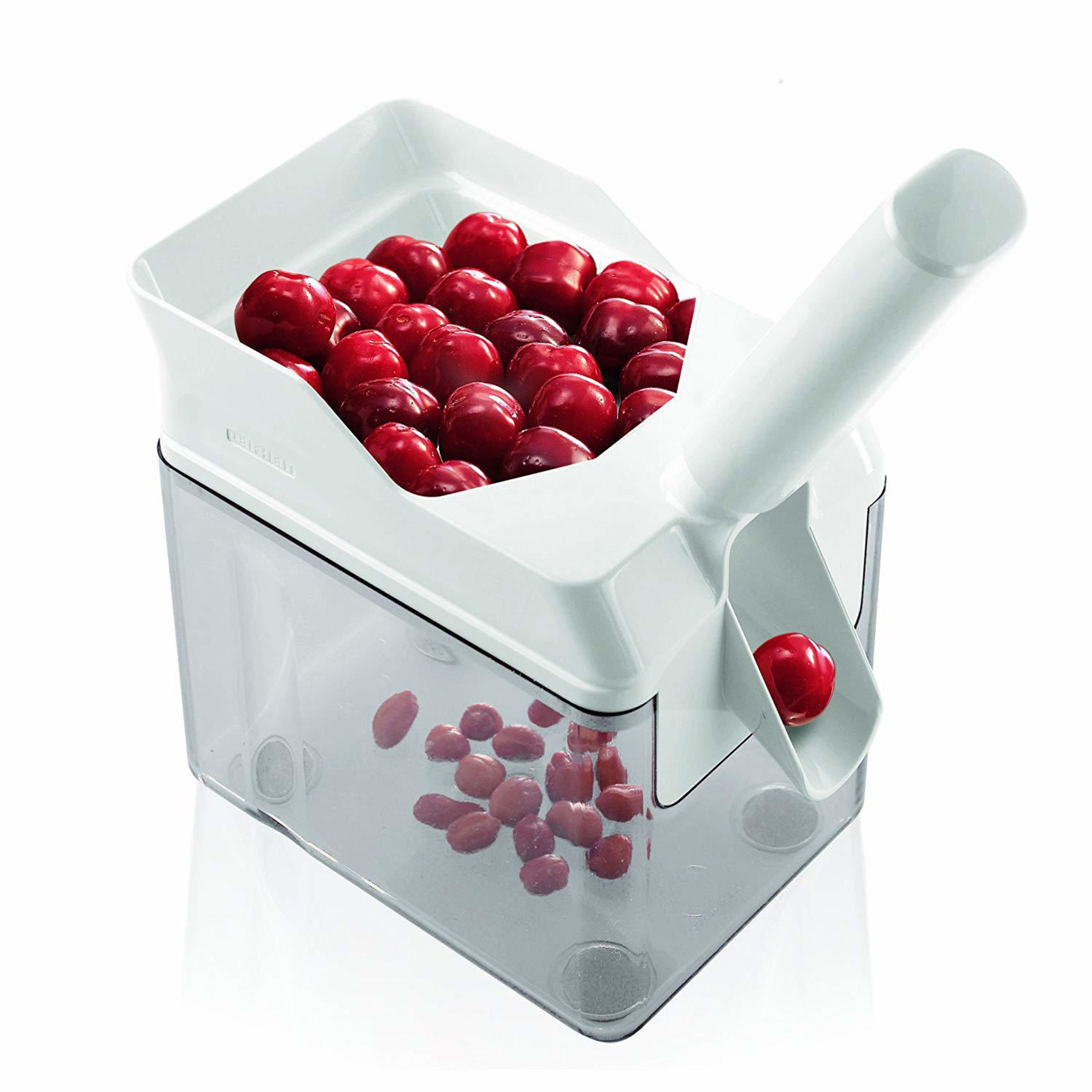 Biała drylownica do czereśni z przezroczystym pojemnikiem pełnym czereśni.