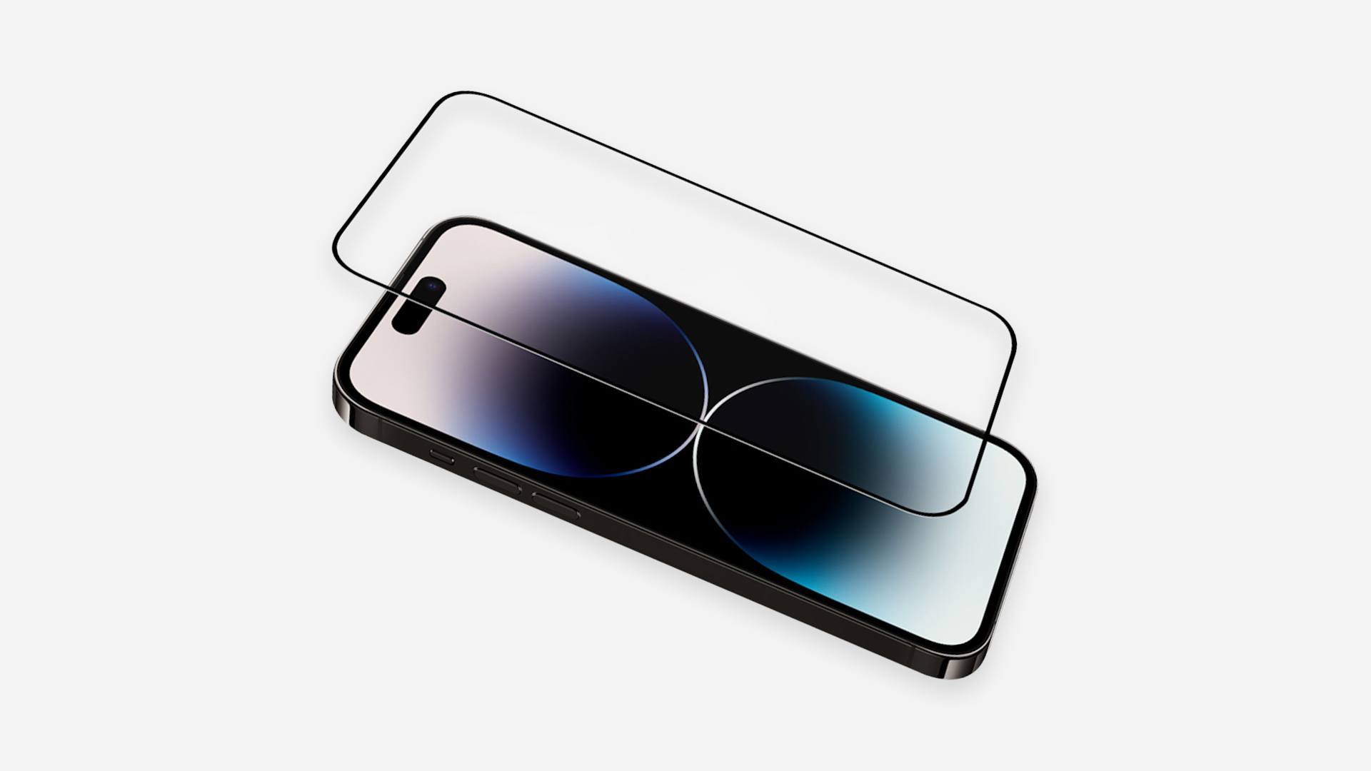 A black smartphone lies next to a screen protector on a white background.