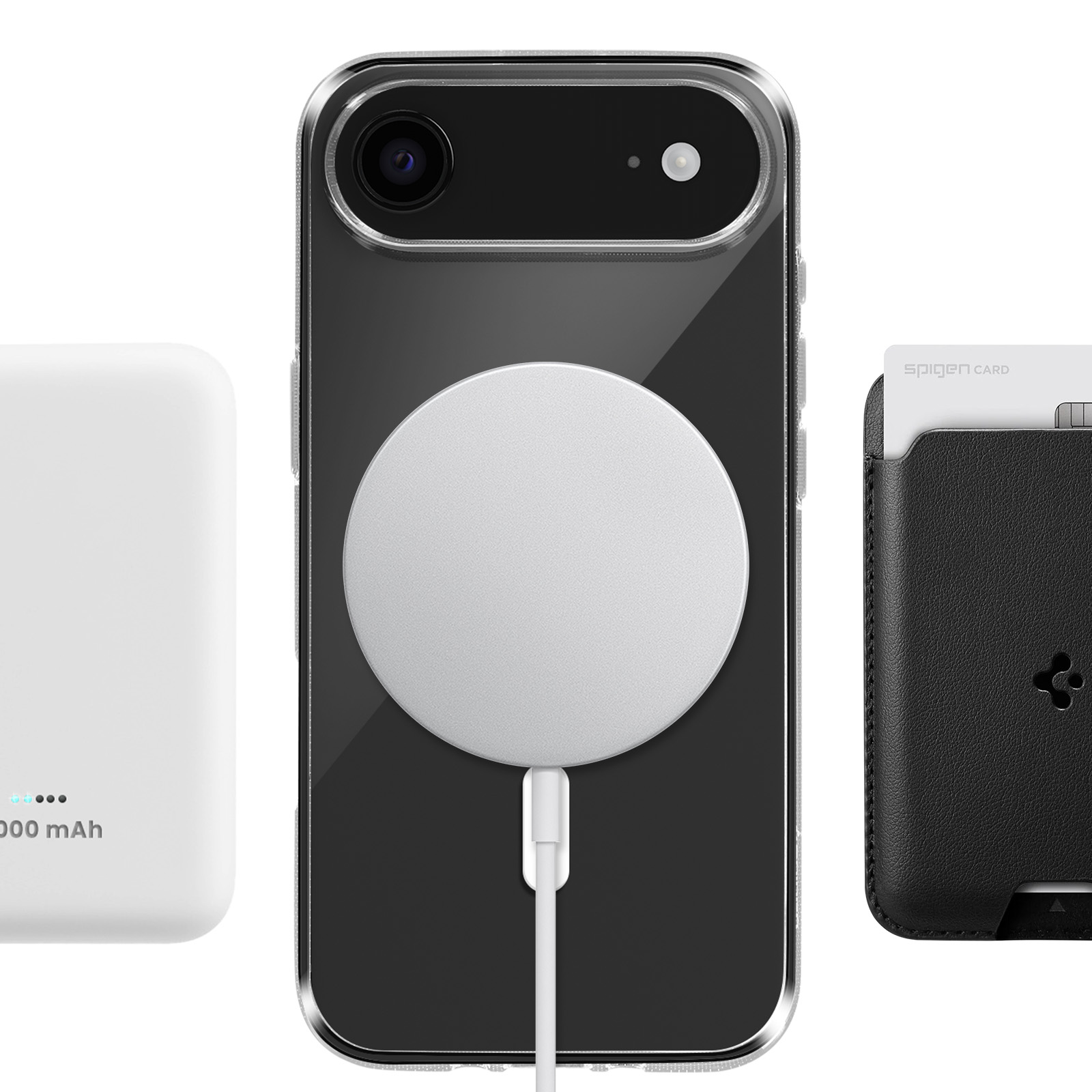 Un caricabatterie bianco, un telefono nero con anello di ricarica e un porta carte nero.