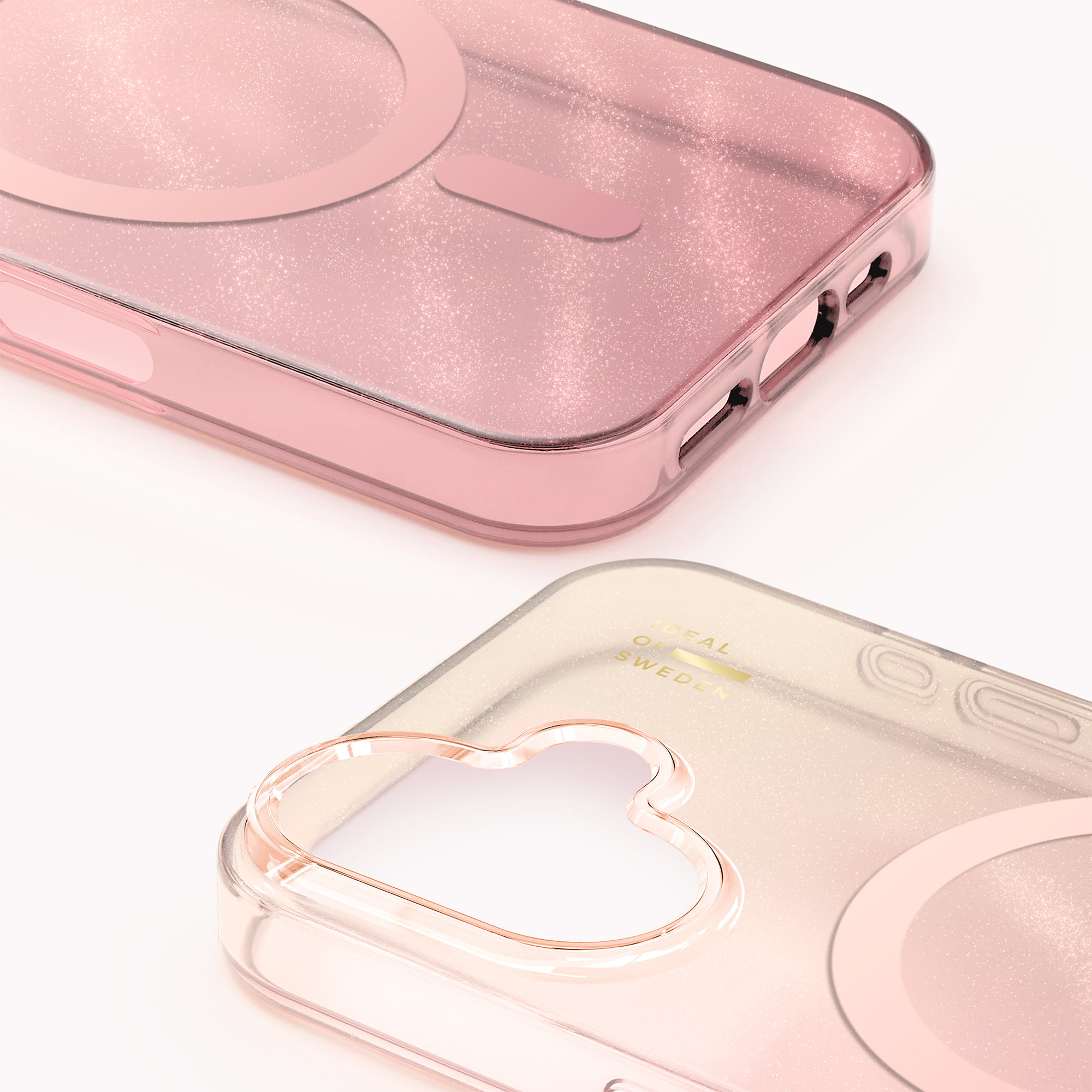 Zwei durchscheinende, glitzernde Handyhüllen in Rosa und Gold auf weißem Grund.