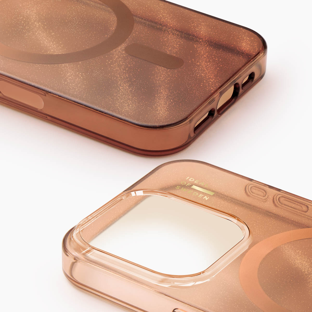 Zwei durchscheinende, glitzernde Handyhüllen in Roségold auf weißem Hintergrund.