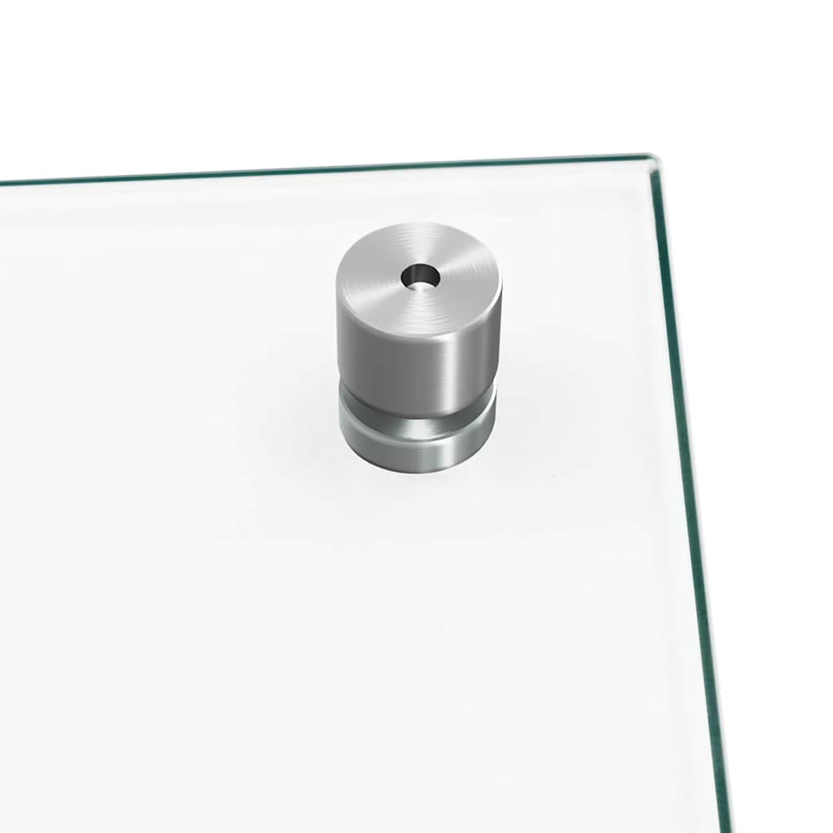 Ein zylindrischer Metallstift mit Loch auf einer Glasplatte.