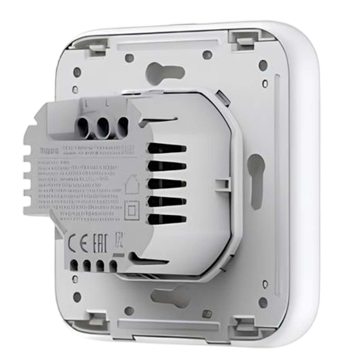 Il retro di un dispositivo bianco con un blocco terminali grigio e fessure di ventilazione.