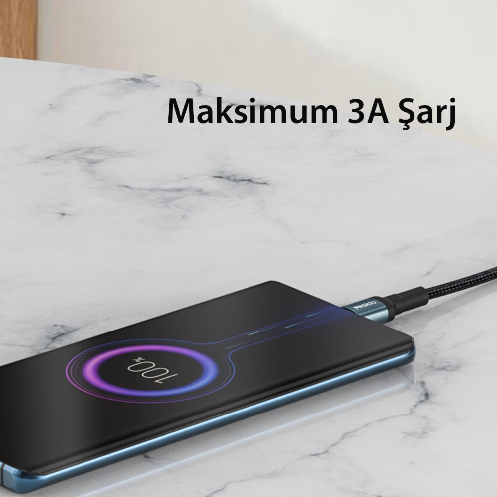 Mermer masada şarja bağlı %100 dolu akıllı telefon gösteriliyor.