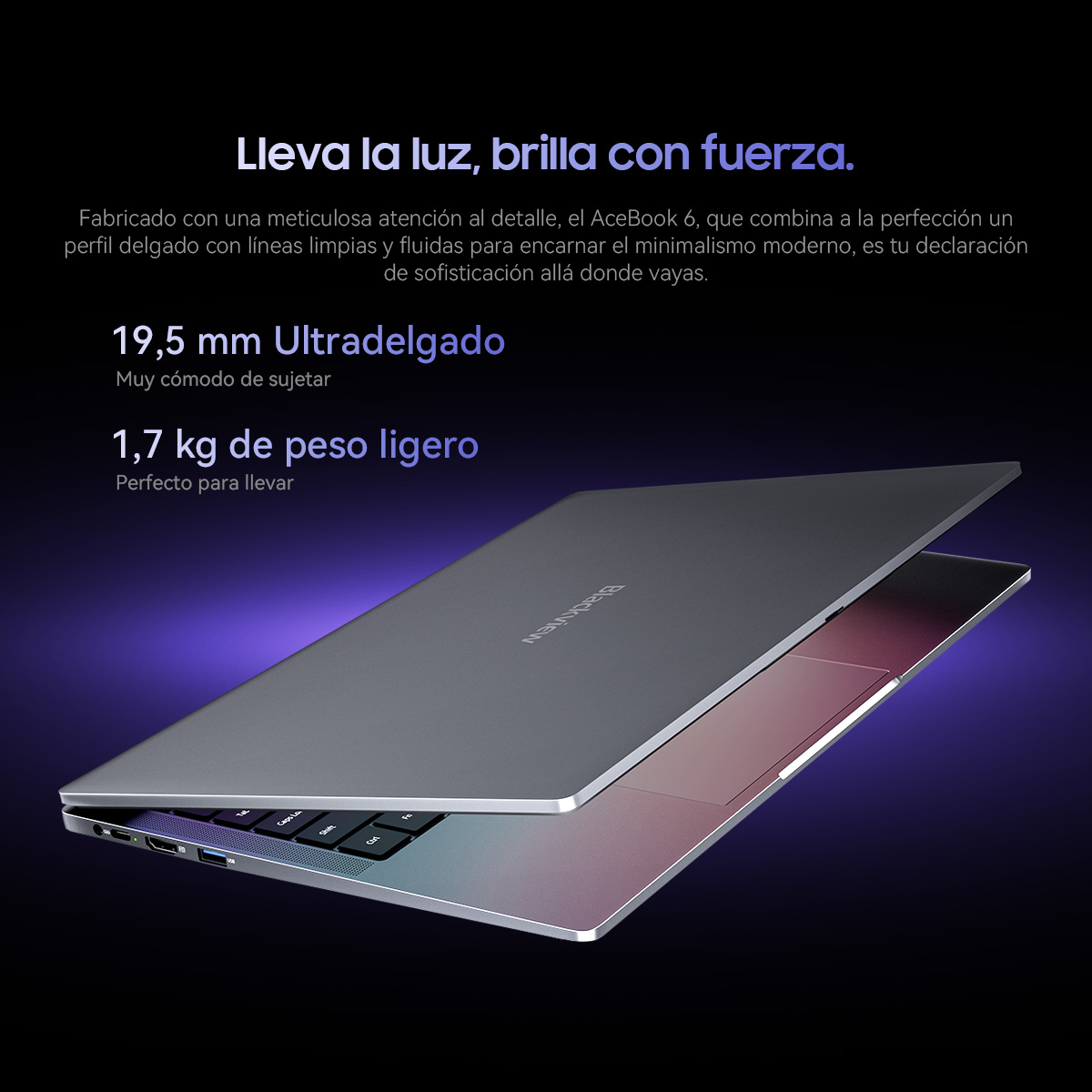 Un portátil elegante y ligero con carcasa oscura y teclado iluminado.