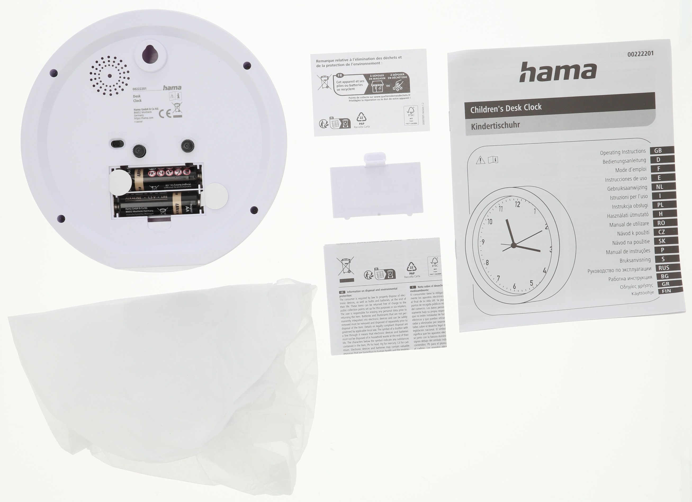 Tył białego dziecięcego budzika Hama z otwartą komorą baterii i instrukcją.
