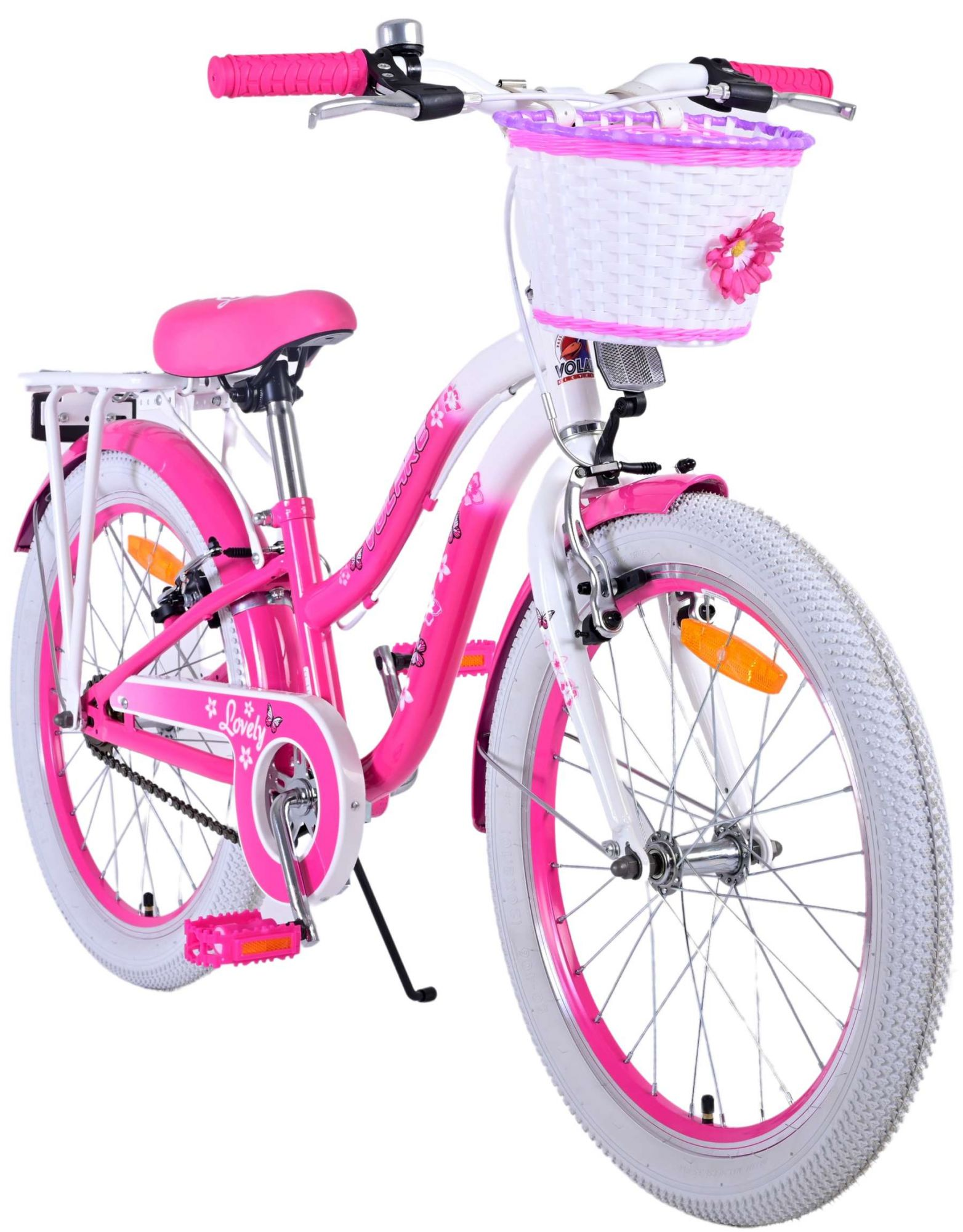 Ein pinkes und weißes Mädchenfahrrad mit weißem Korb und Blumen.